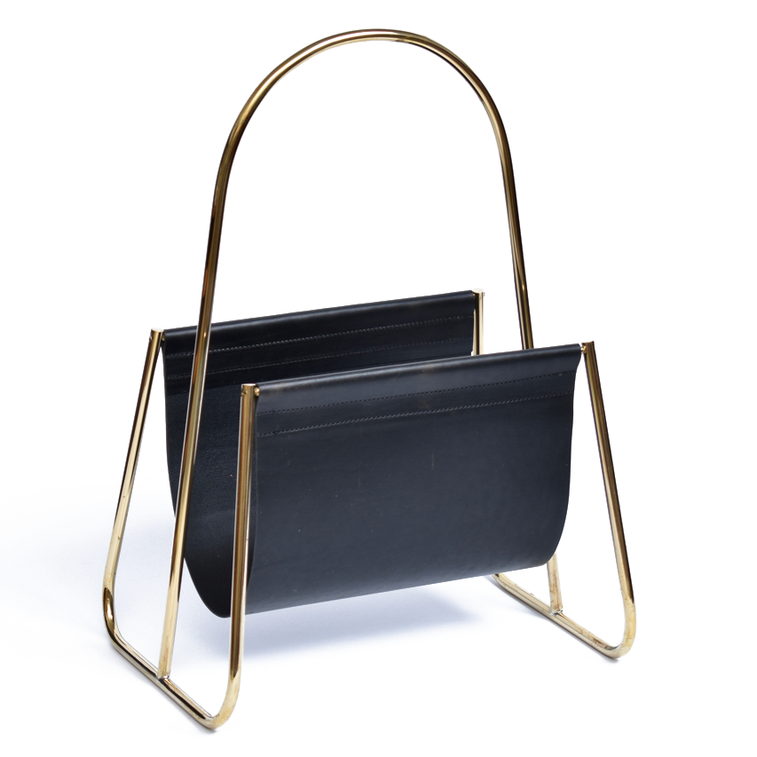 The Magazine Rack #4019 by Werkstätte Carl Auböck boasts a sleek, modern design with a gold metal frame and black leather holder. Its elegant curved handles and minimal style offer a contemporary aesthetic reminiscent of Carl Auböcks work.