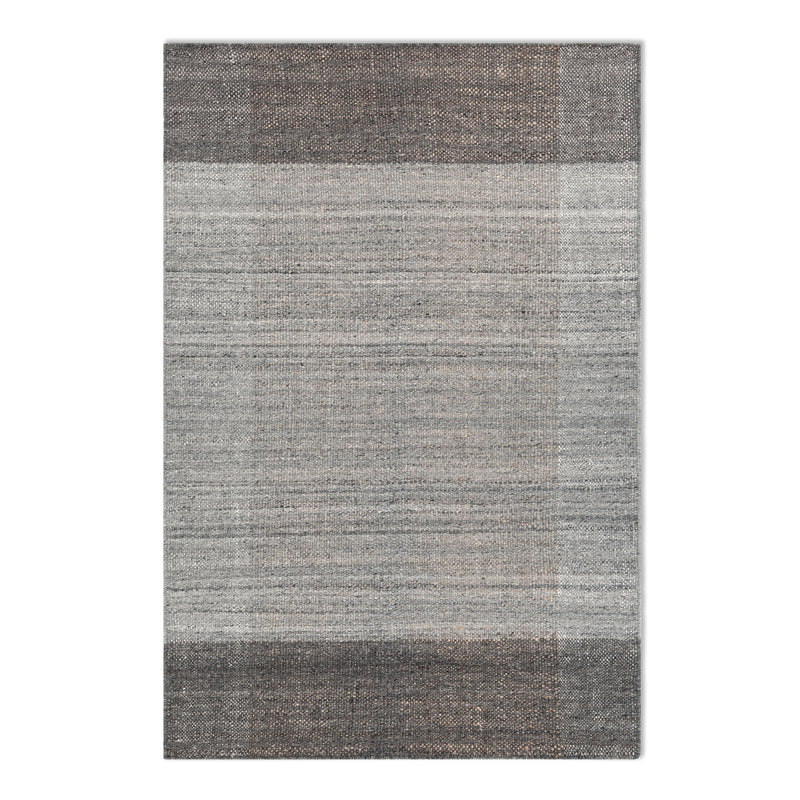 The Echo Rug by Gus Modern features a flatweave design with a woven texture and horizontal stripes in gray and beige tones, creating a subtle gradient effect.