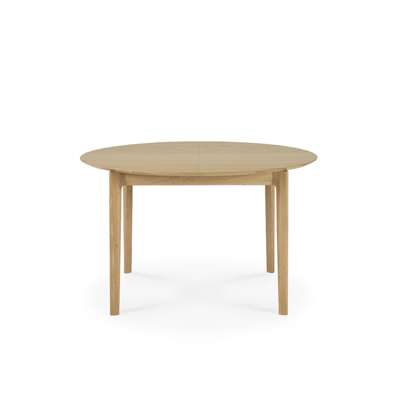 Bok Extendable Dining Table - Round made of solid oak with sculptural design and extendable feature for extra seating.