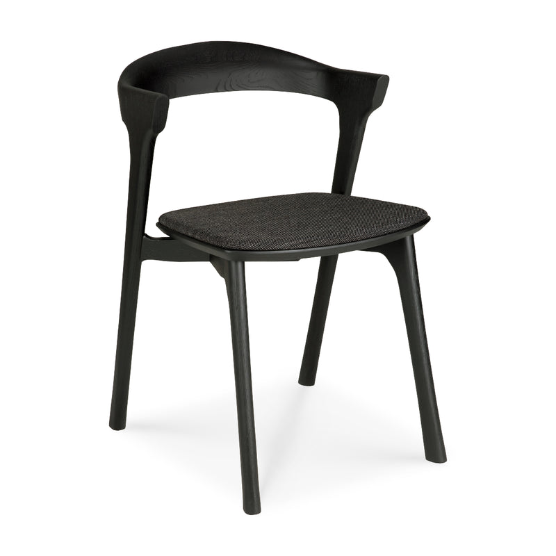 Bok Dining Chair - Upholstered in black with ergonomic design, varnished oak frame, and comfortable cushioned seat.