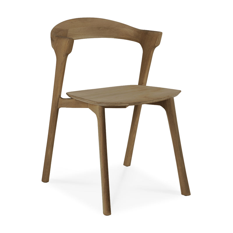 Bok Dining Chair in varnished oak with ergonomic design and modern style, perfect for any dining room.