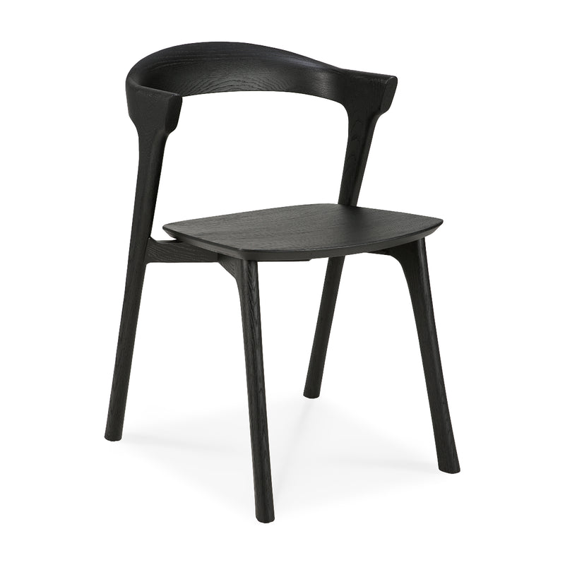 Bok Dining Chair in black varnished oak with ergonomic design and sleek modern style for dining rooms.