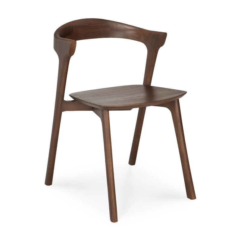 Bok Dining Chair in varnished teak with ergonomic design and sleek modern style for any dining room setting.