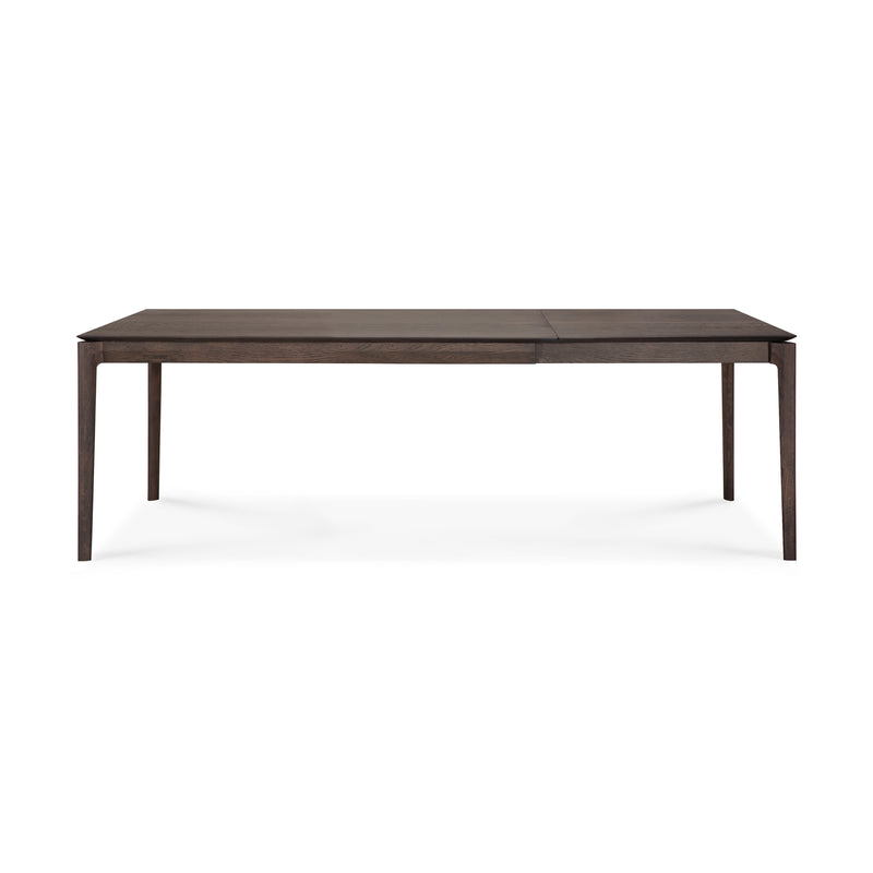The Ethnicraft Bok Extendable Dining Table—rectangular, crafted from solid oak in a dark finish—features clean lines and four straight legs, inspired by the classic Bok design and displayed against a white background.