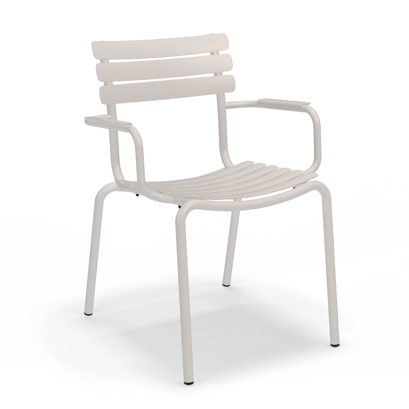 The Alua Dining Chair with Armrest by Houe offers modern design with aluminum construction, featuring horizontal slats on the backrest and seat, armrests, and four straight legs. Its sleek style is enhanced by its stackable nature for easy storage without compromising on aesthetics.