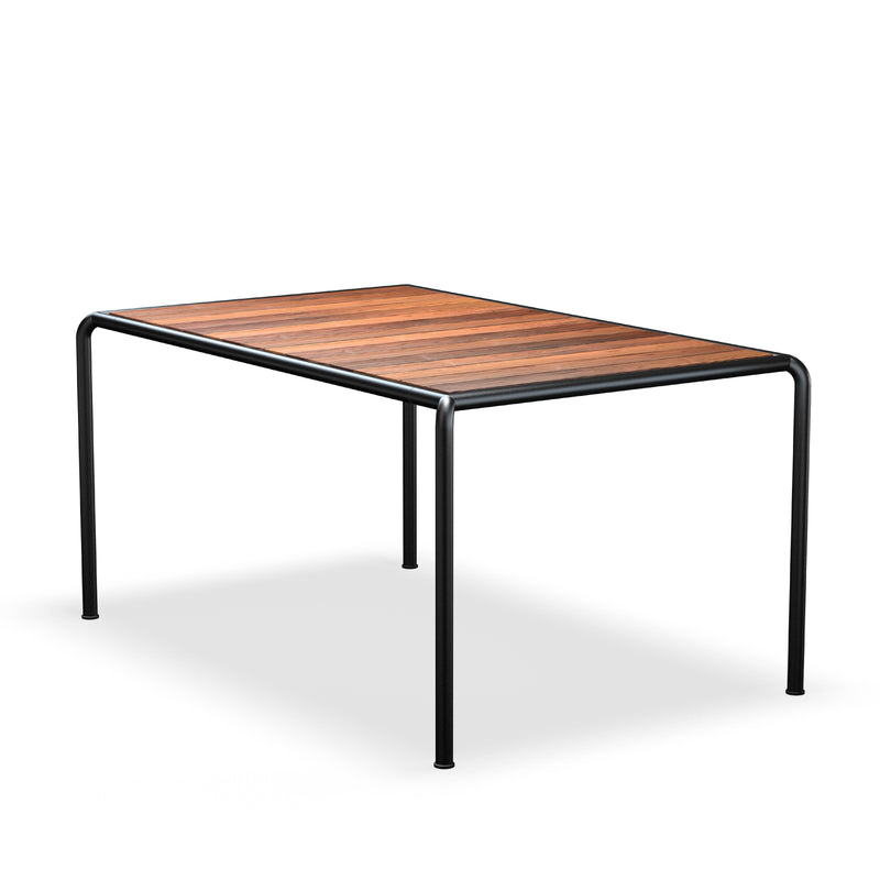 The Houe Avanti Table boasts a rectangular wooden top with sleek black metal legs on a white surface. Its modular design allows for customizable extension sets, providing both style and versatility to your space.