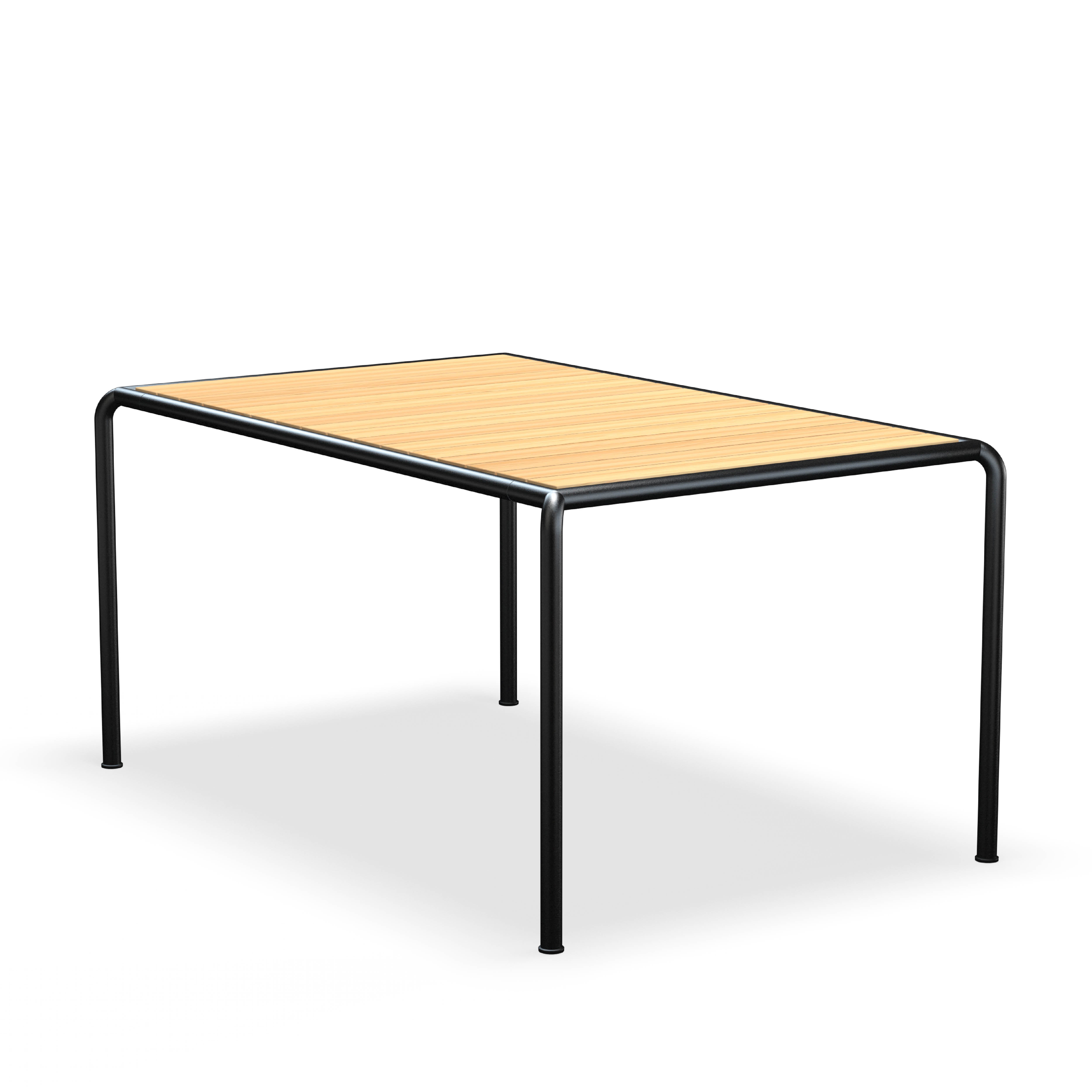 The Avanti Table by Houe features a smooth rectangular wooden top and slim black metal legs, embodying modern elegance. Its modular design provides versatility, and the minimalistic flooring beneath enhances its sleek appearance.