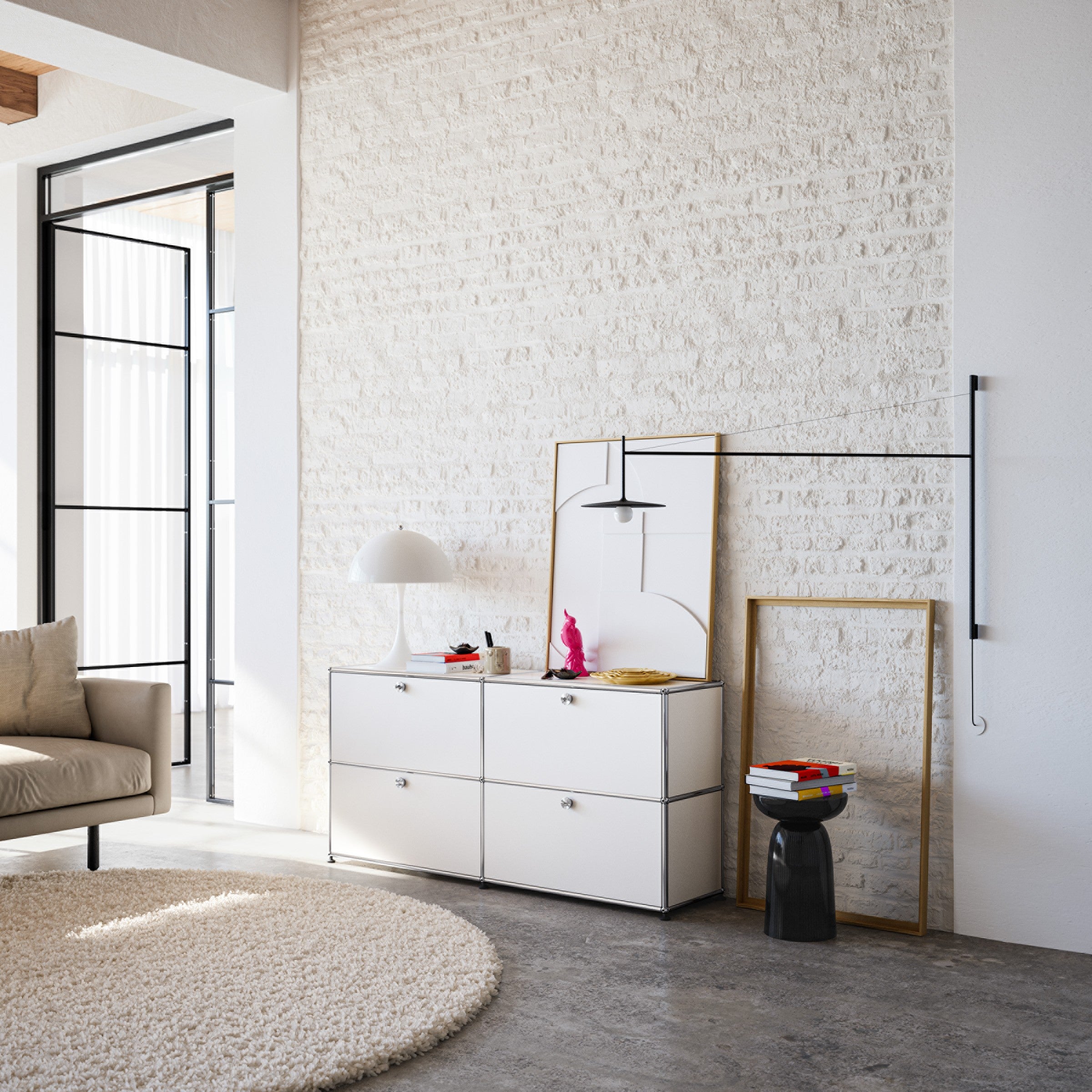 Haller Credenza E2 in Pure White with four drop-down doors in a modern living room setting.