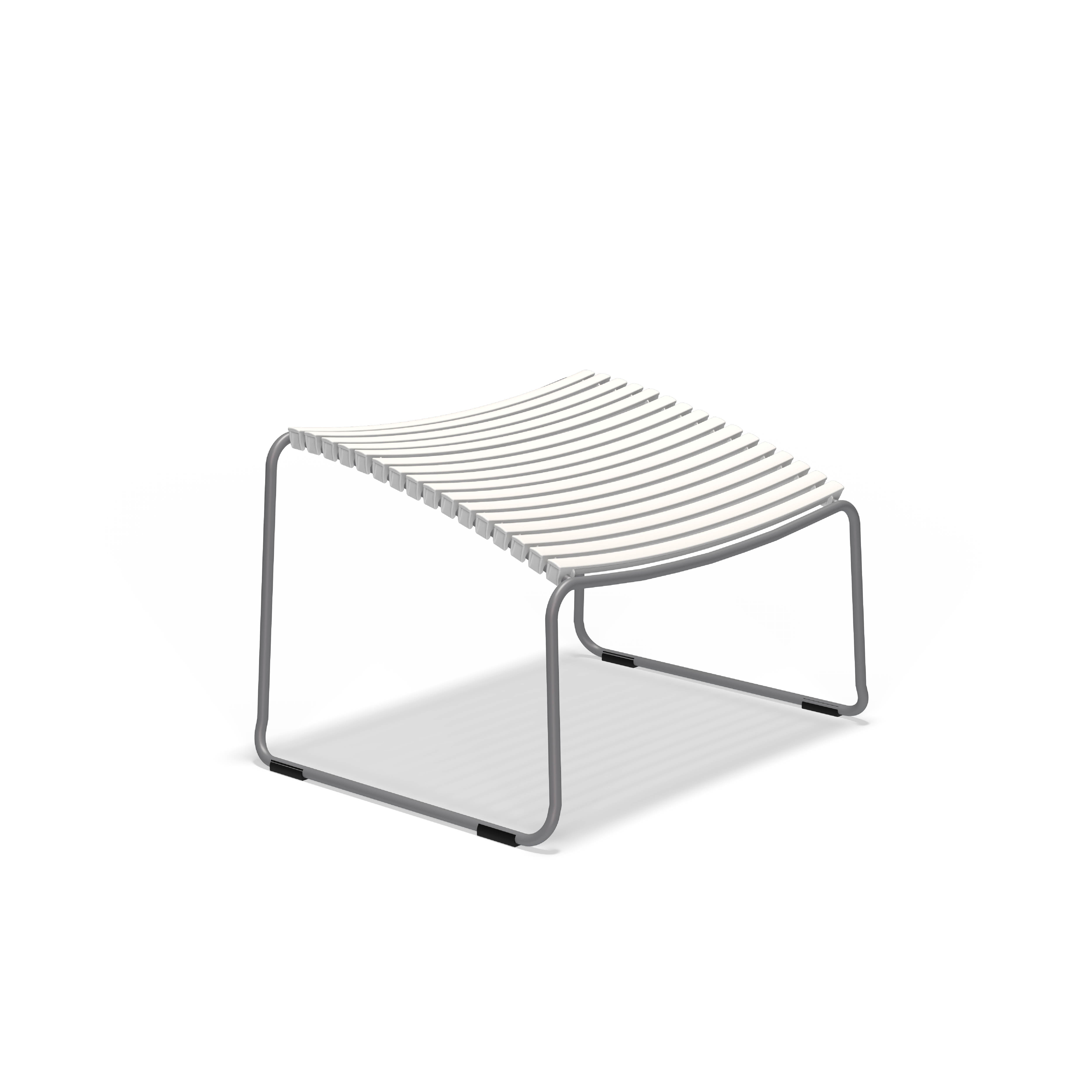 The Click Footrest by Houe is a modern minimalist bench with sleek white plastic lamellas, a gray metal frame, and curved legs, featuring a UV-protected lightweight design.