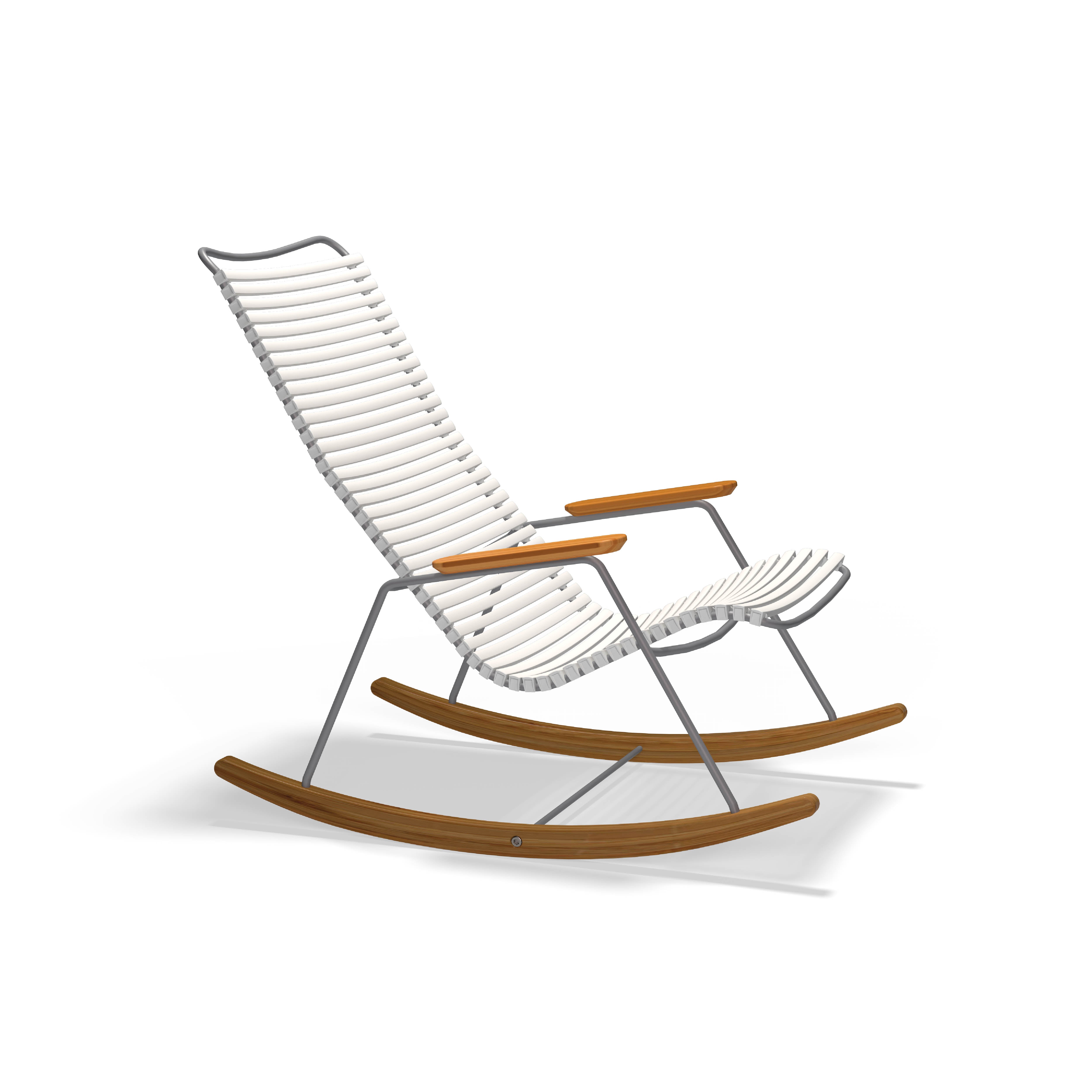 The Click Rocking Chair by Houe is a modern blend of contemporary and classic design, featuring a sleek curved metal frame, ribbed weather-resistant cushioned seat and backrest, wooden armrests, and rockers, ideal for outdoor enjoyment.
