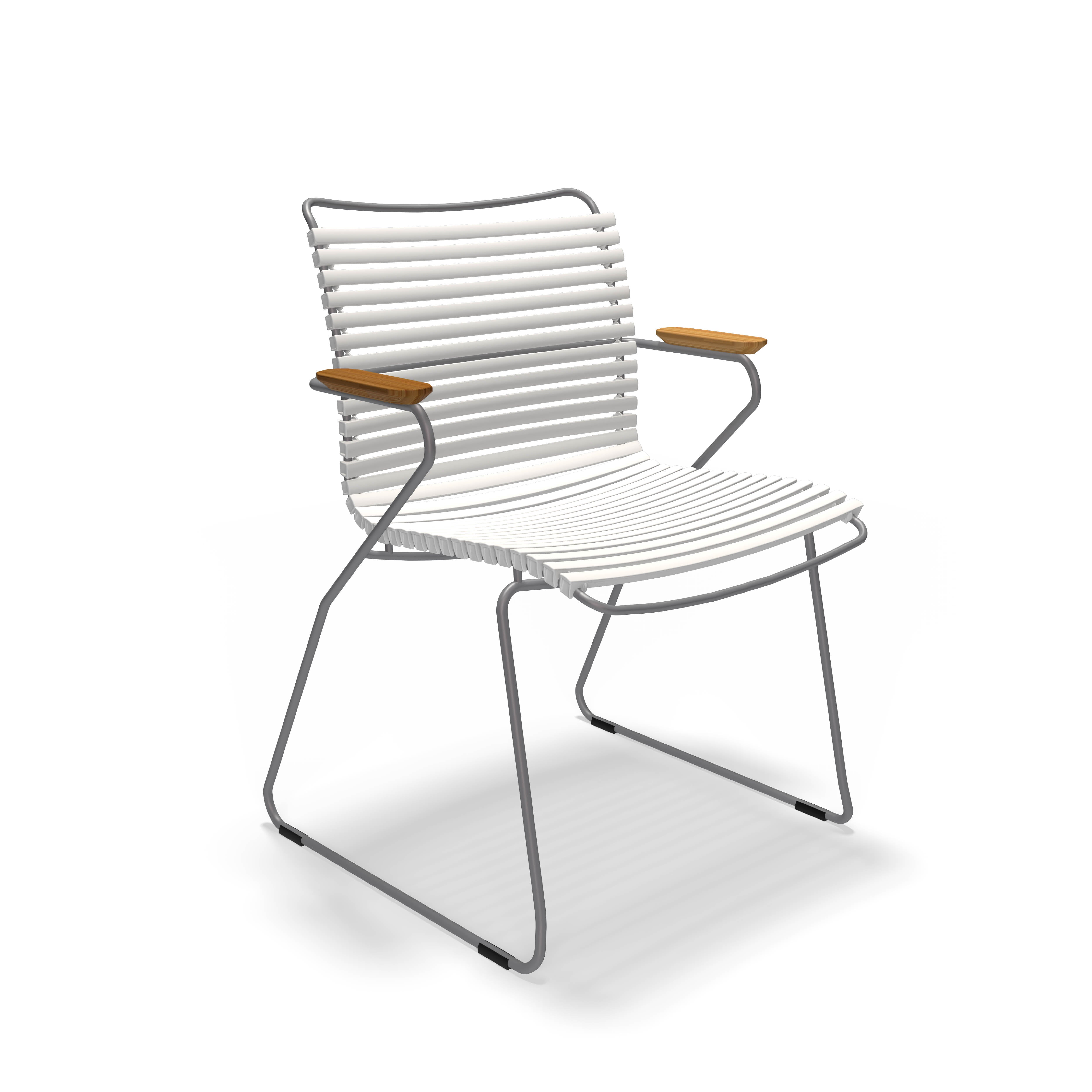 The Click Dining Chair with Armrest by Houe is a modern outdoor chair with a minimalist design, featuring a weather-resistant white ribbed seat and backrest, silver metal frame, and wooden armrests. Its sled-style base adds to its sleek look, perfect for stylish alfresco settings.