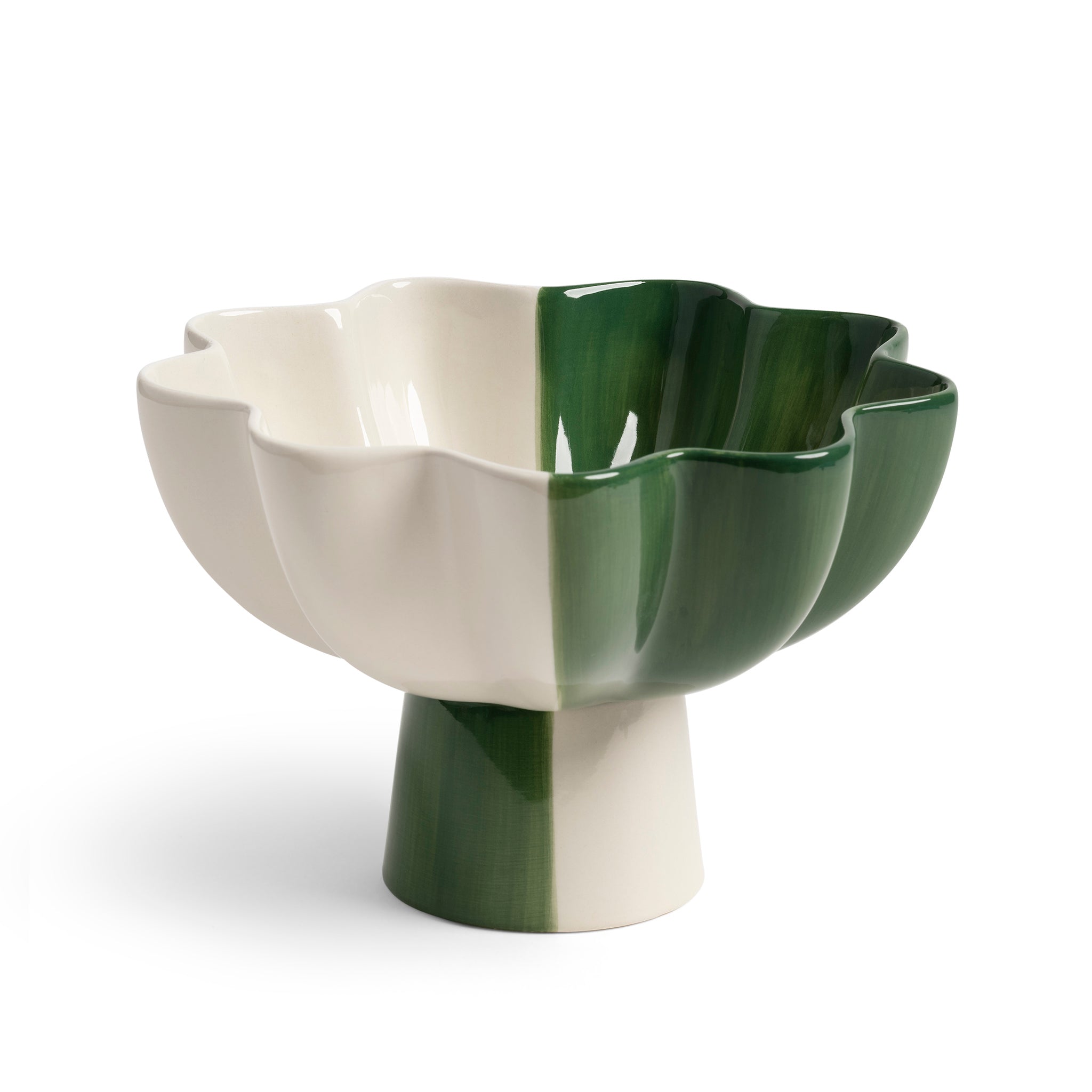 The Fruit Bowl Sun Green Small by &Klevering features a multi-color flower-like stoneware design with a glossy finish and alternating green and white sections, resting on a cylindrical pedestal base, making it an elegant and modern fruit bowl.