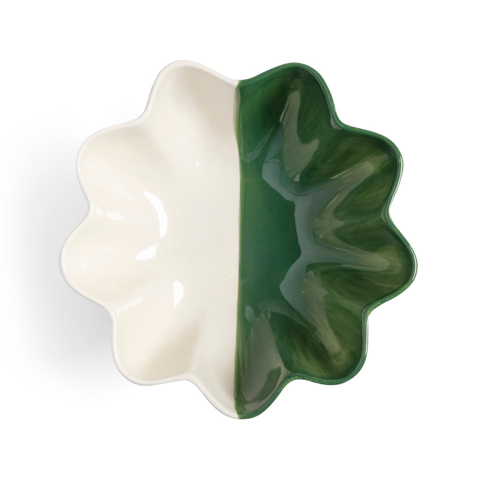The Fruit Bowl Sun Green Small by &Klevering is a scalloped stoneware bowl with two halves, one cream and one green, forming a symmetrical, floral-like shape. Its multicolor glossy surfaces beautifully reflect light.