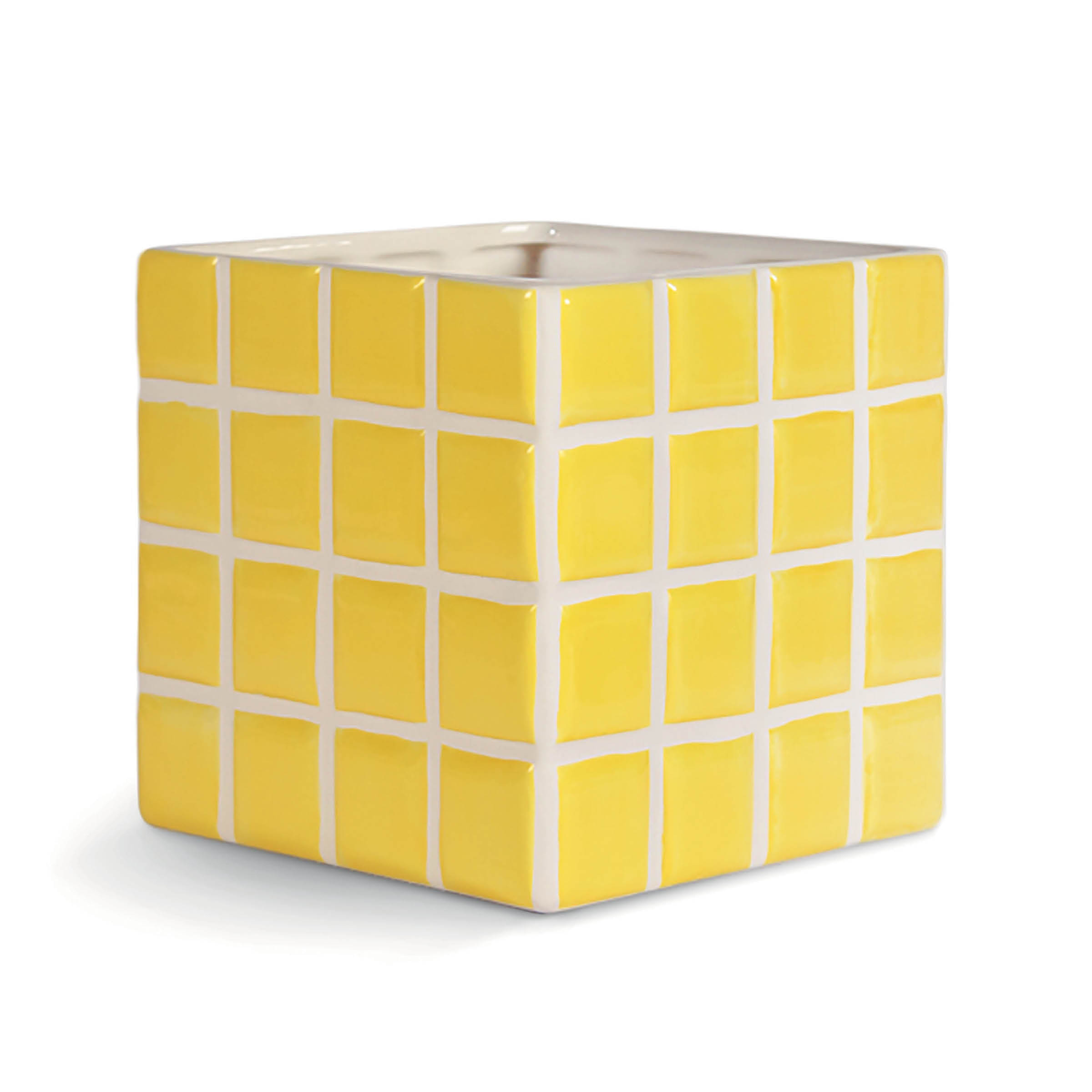 The Vase Tile Yellow by &Klevering is a cube-shaped tissue box cover. It features a candy-colored design with bright yellow sides and square tiles outlined in white, plus an opening on top for tissues.