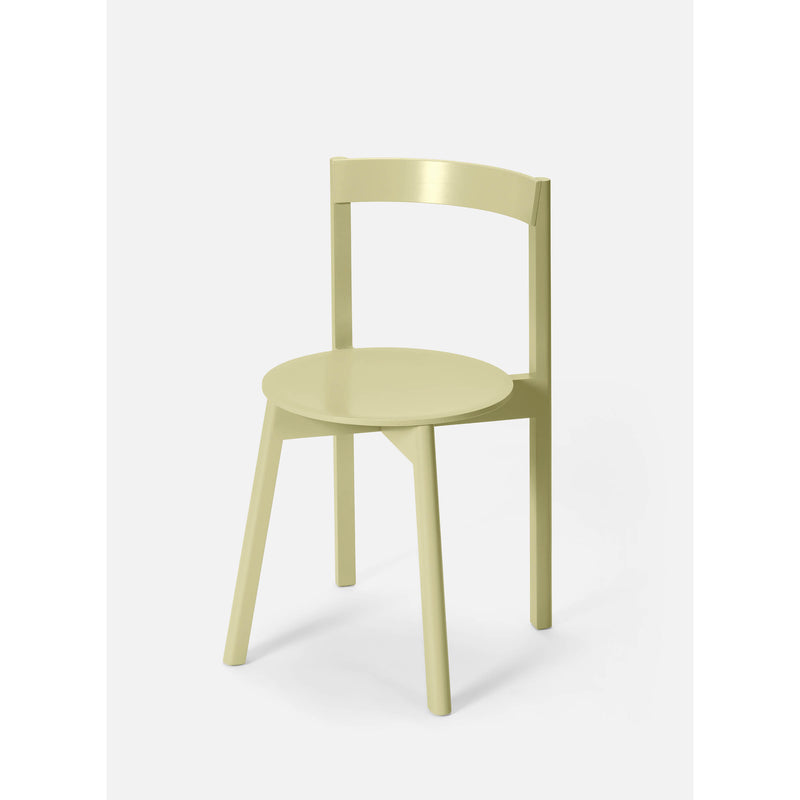 Introducing the L5 JAZZ Side Chair by Loehr: a modern, light green chair with an iconic silhouette. It features a round seat, slightly curved plywood backrest, and three legs—two at the front and one at the back—standing gracefully against a plain white backdrop.