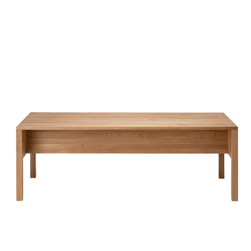 The L8 Traba Table from Loehr is a wooden coffee table with a simple rectangular design and four straight legs, providing structural stability. Its natural wood finish highlights the beautiful grain patterns.