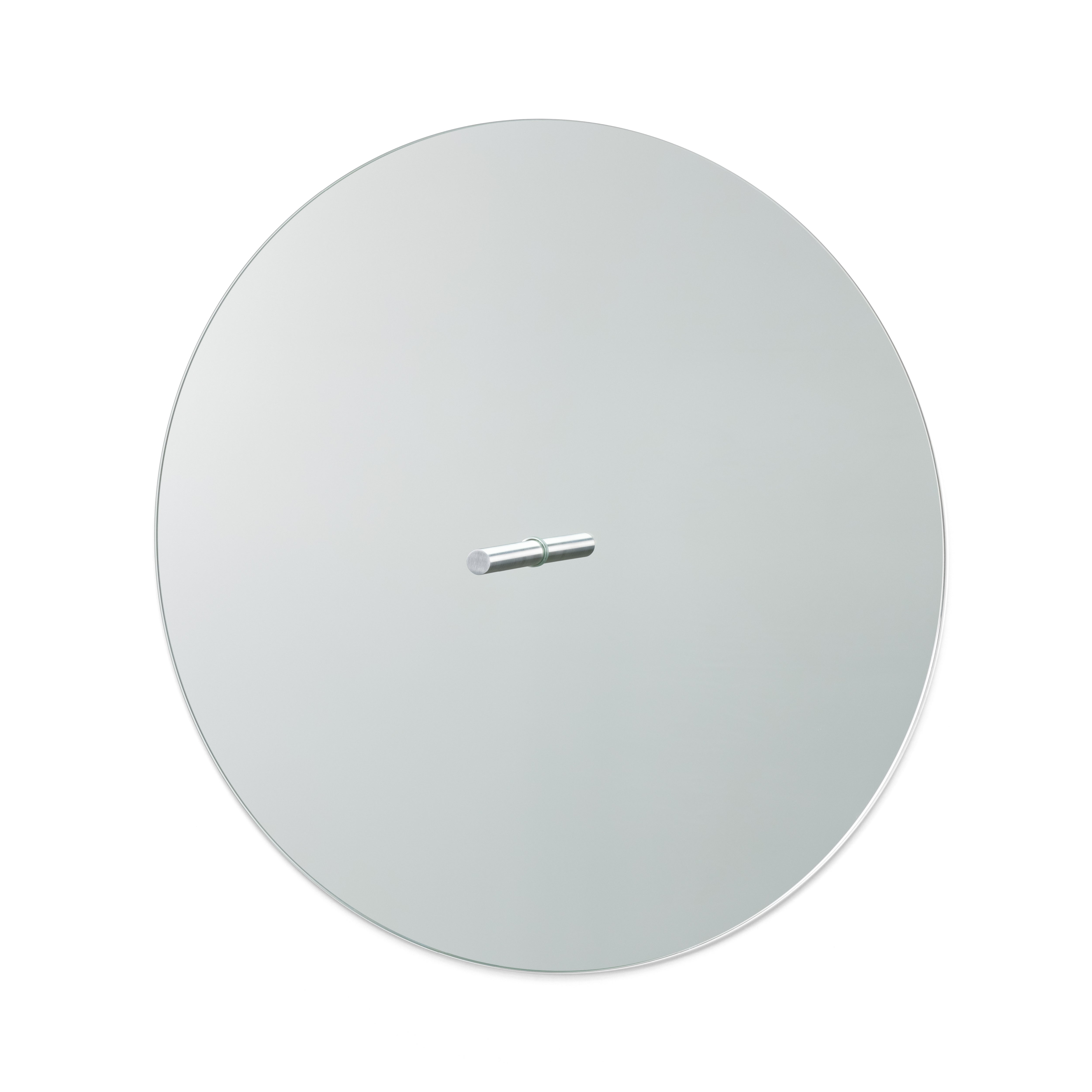 The L9 Portal by Loehr is a round wall mirror featuring a minimalist design with a silver peg for mounting. Its frameless, reflective surface creates an elegant and functional decorative piece against a plain white backdrop.