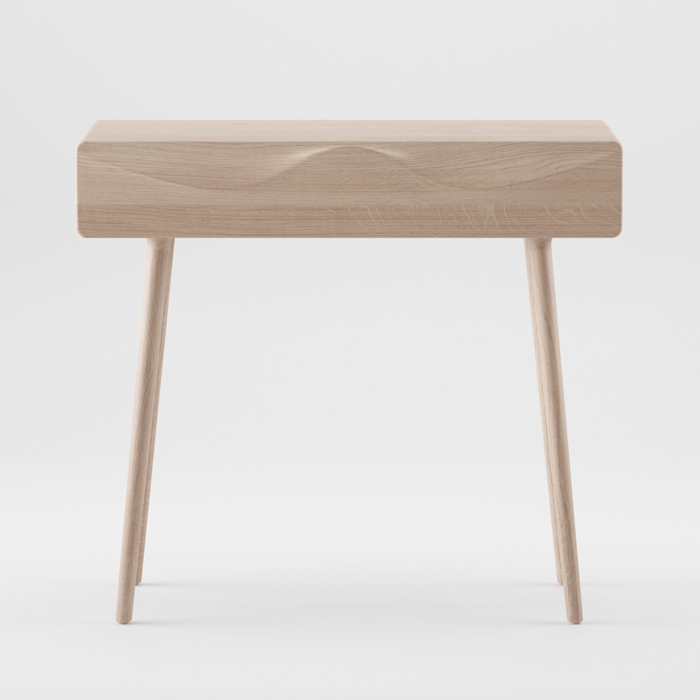 The LASTA Console Table by Artisan is a minimalist solid wood table with clean lines, a rectangular top, and three slightly angled legs. It features an eco-friendly natural wood finish and is displayed against a plain white background.