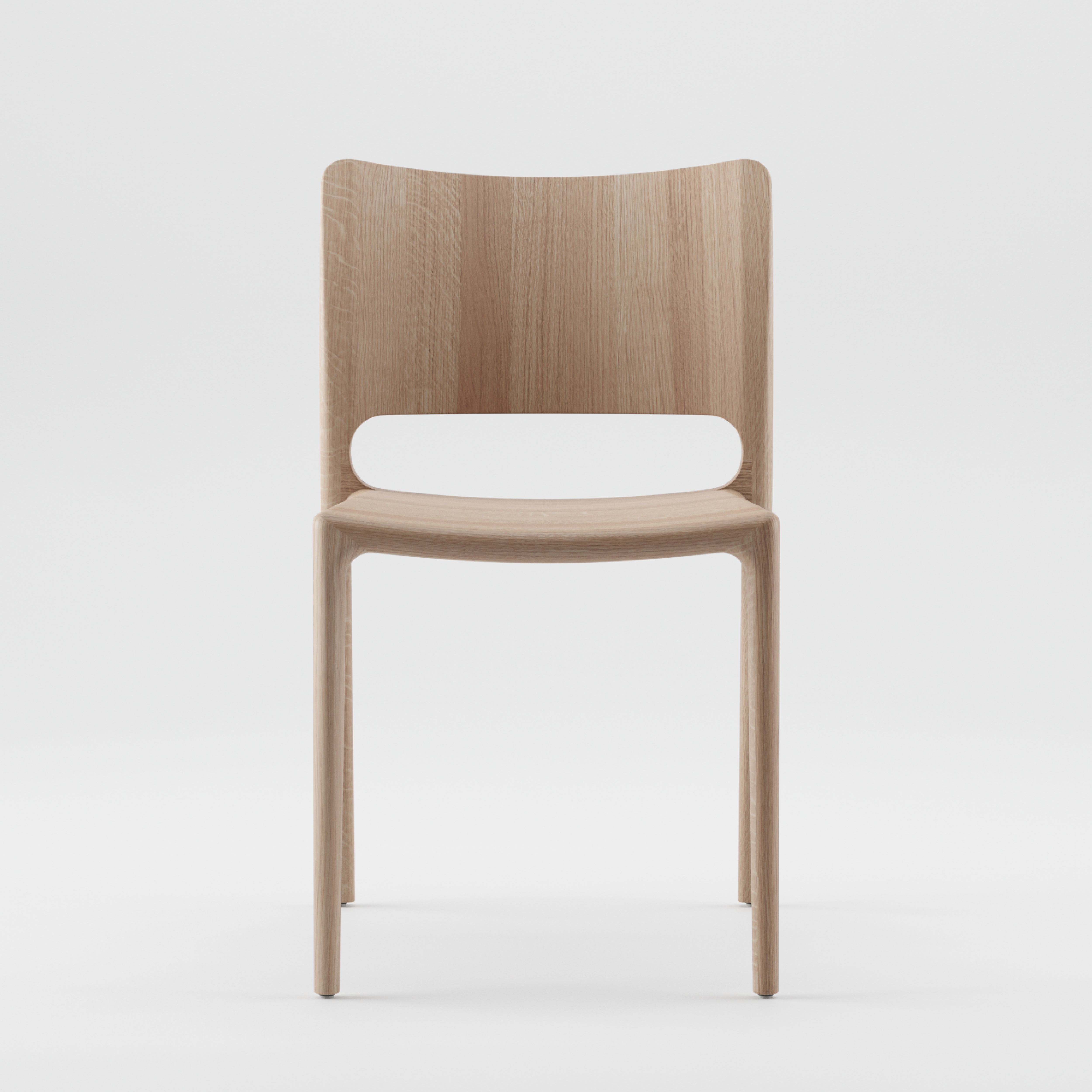 The LATUS Chair by Artisan is a simple, modern wooden chair crafted from solid wood with a smooth, light finish. It features a curved backrest and minimalist design and is made using environmentally-friendly materials, set against a plain white background.