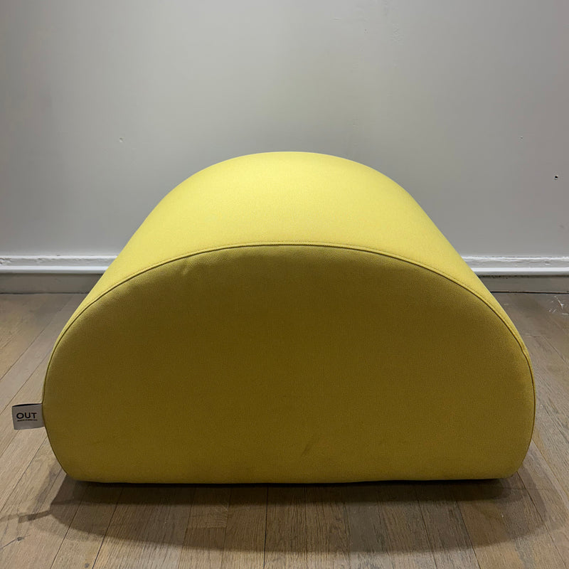 Levi Pouf - Sale in vibrant yellow upholstery with a smooth, rounded organic shape on wooden floor background
