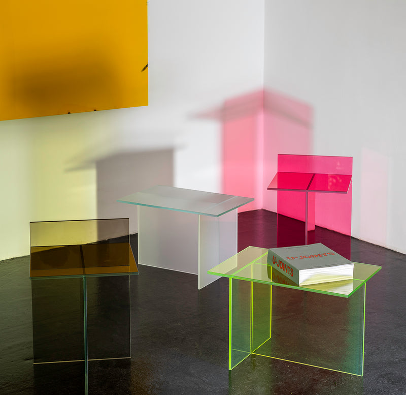 THEO Glass Side Table shown in multiple colors with intersecting glass elements forming a T shape from different angles