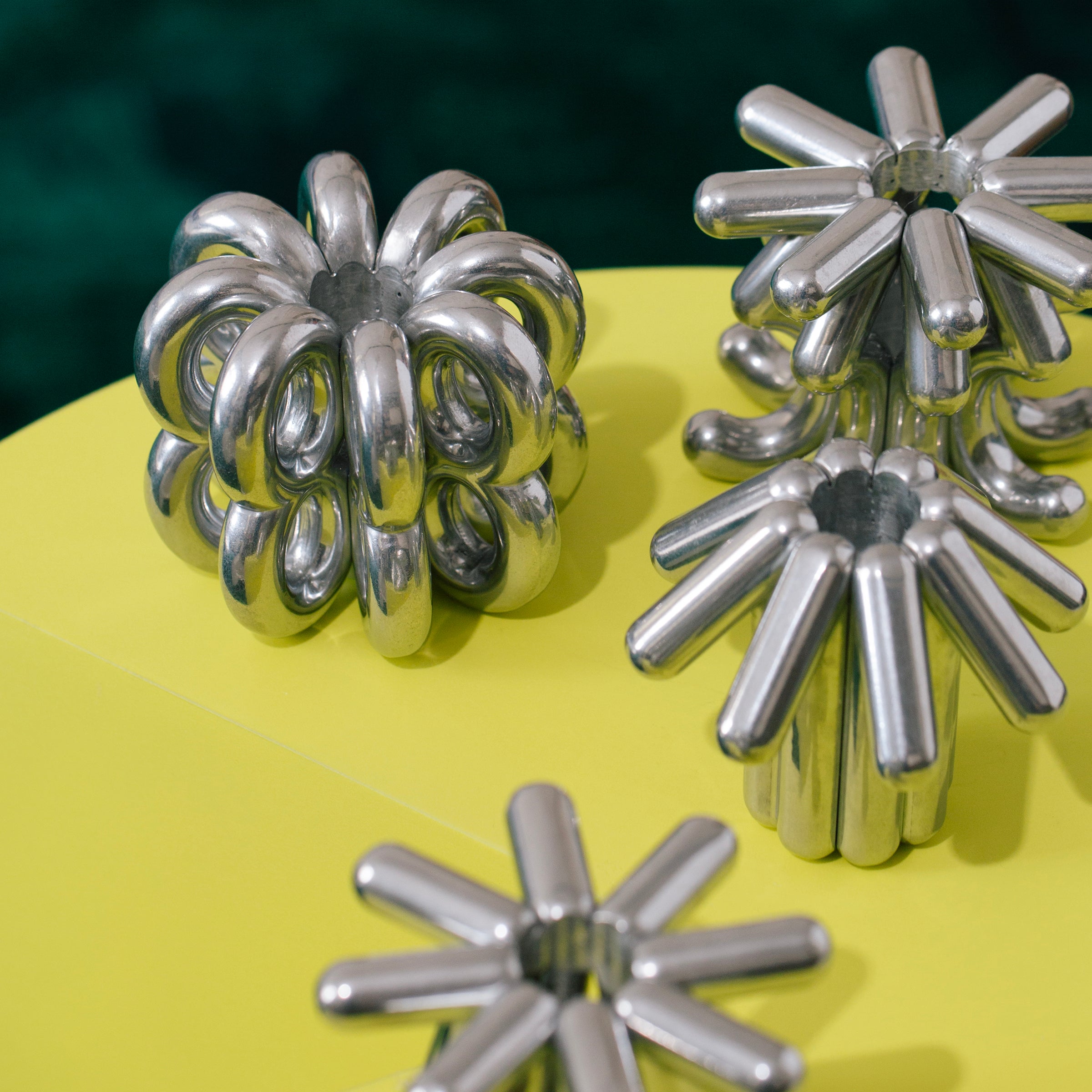 DIGIT NINE Candlestick in polished aluminum with unique tubular design, modern decorative candlestick for any occasion.