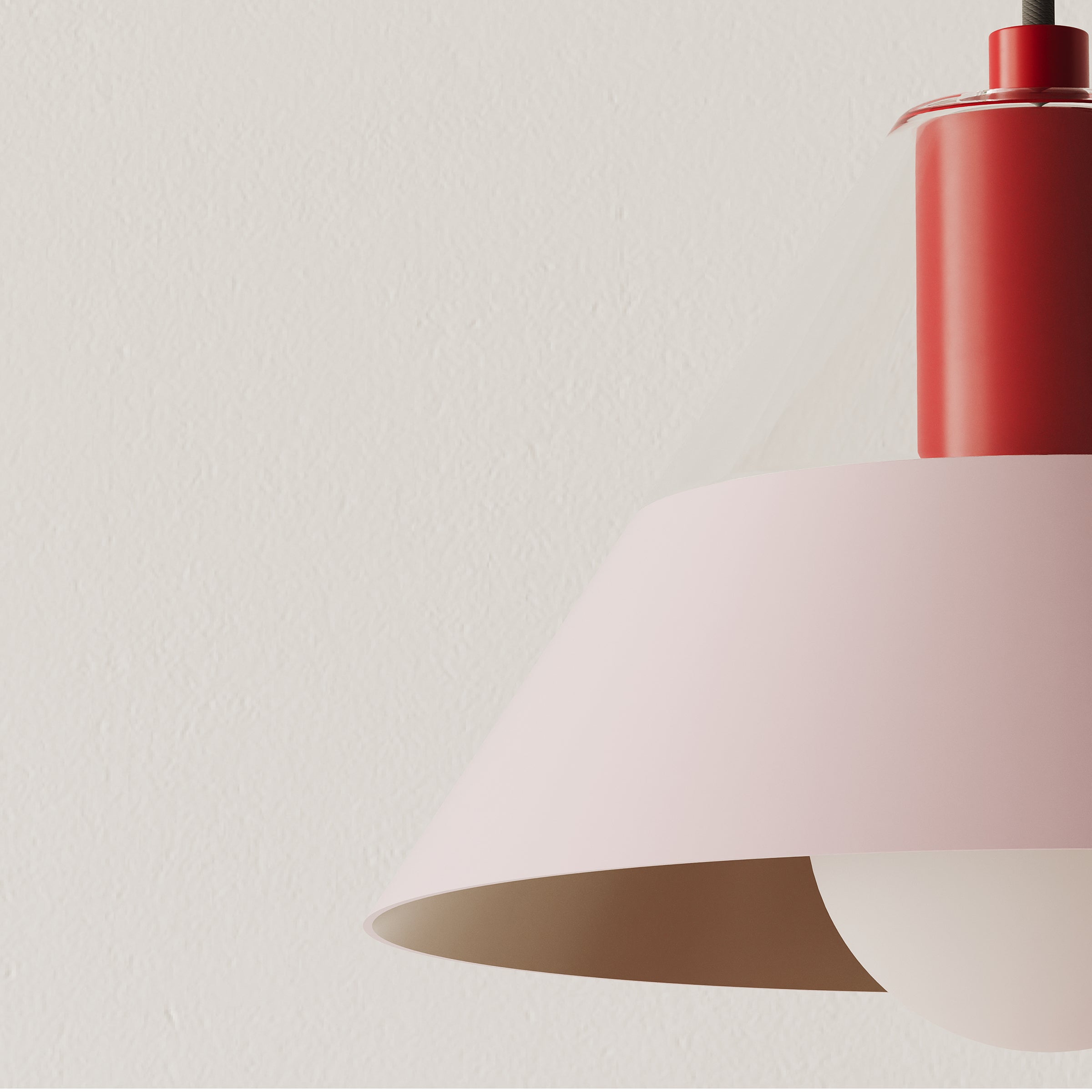 FIFTY FIFTY lamp with a pastel pink metal shade and red wooden socket, blending soft and focused light.