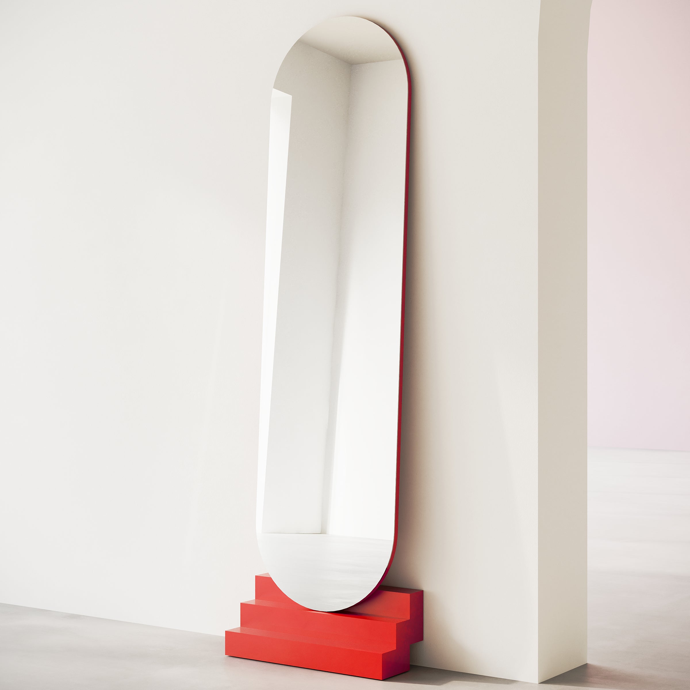 NONCHALANT Mirror with rounded top and red lacquered beech stairs, wall-mounted in a minimalist room.
