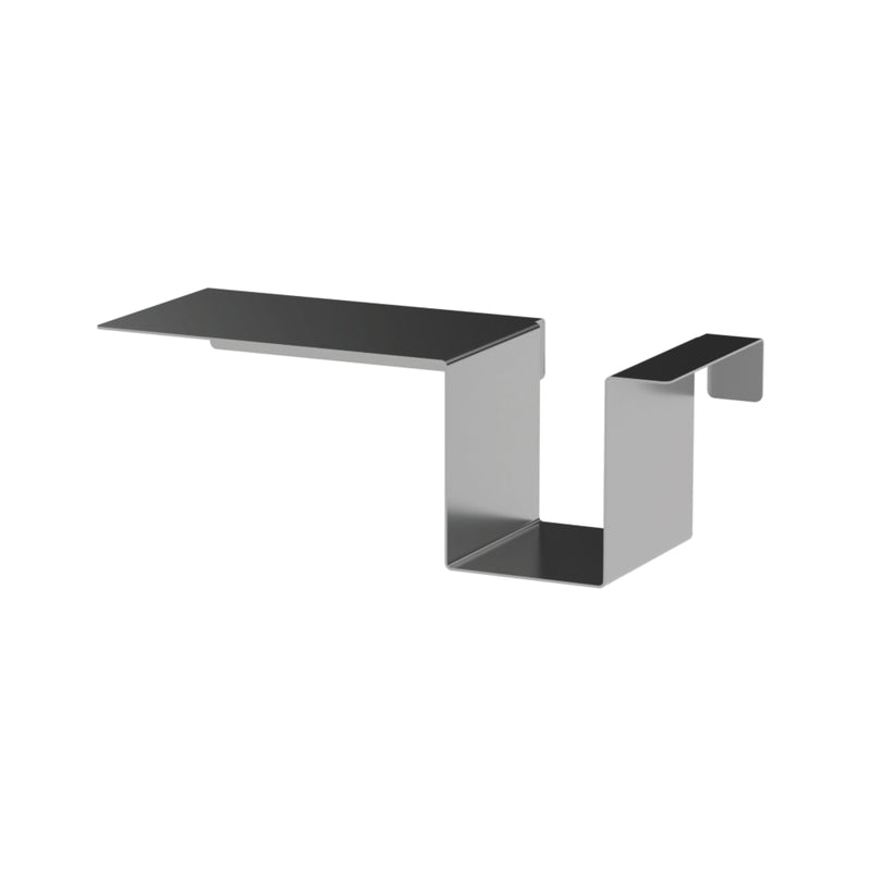The Moormann Tagedieb is a modern black and gray metal bracket with a flat top and zigzag shape, ideal for adjustable mattress support. Its minimalist design ensures secure object holding.