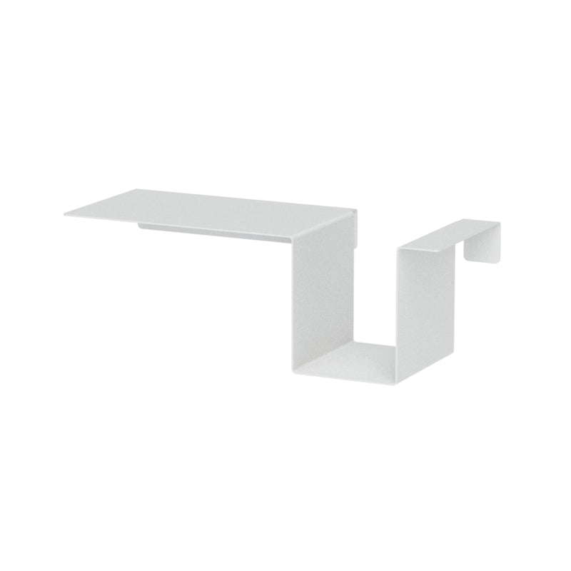 The Tagedieb by Moormann is a minimalist white, zigzag-shaped bracket designed to hold shelves. With right angles and flat surfaces, it complements high headboards with modern support and sleek style.