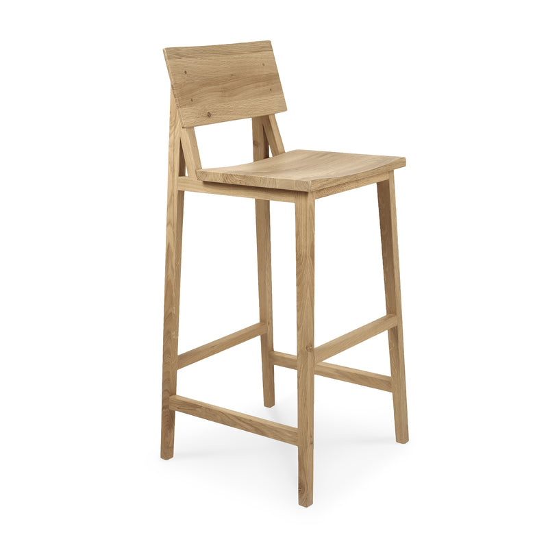 N4 Bar Stool made of varnished oak with a minimalist design by Nathan Yong, featuring a backrest and footrest.