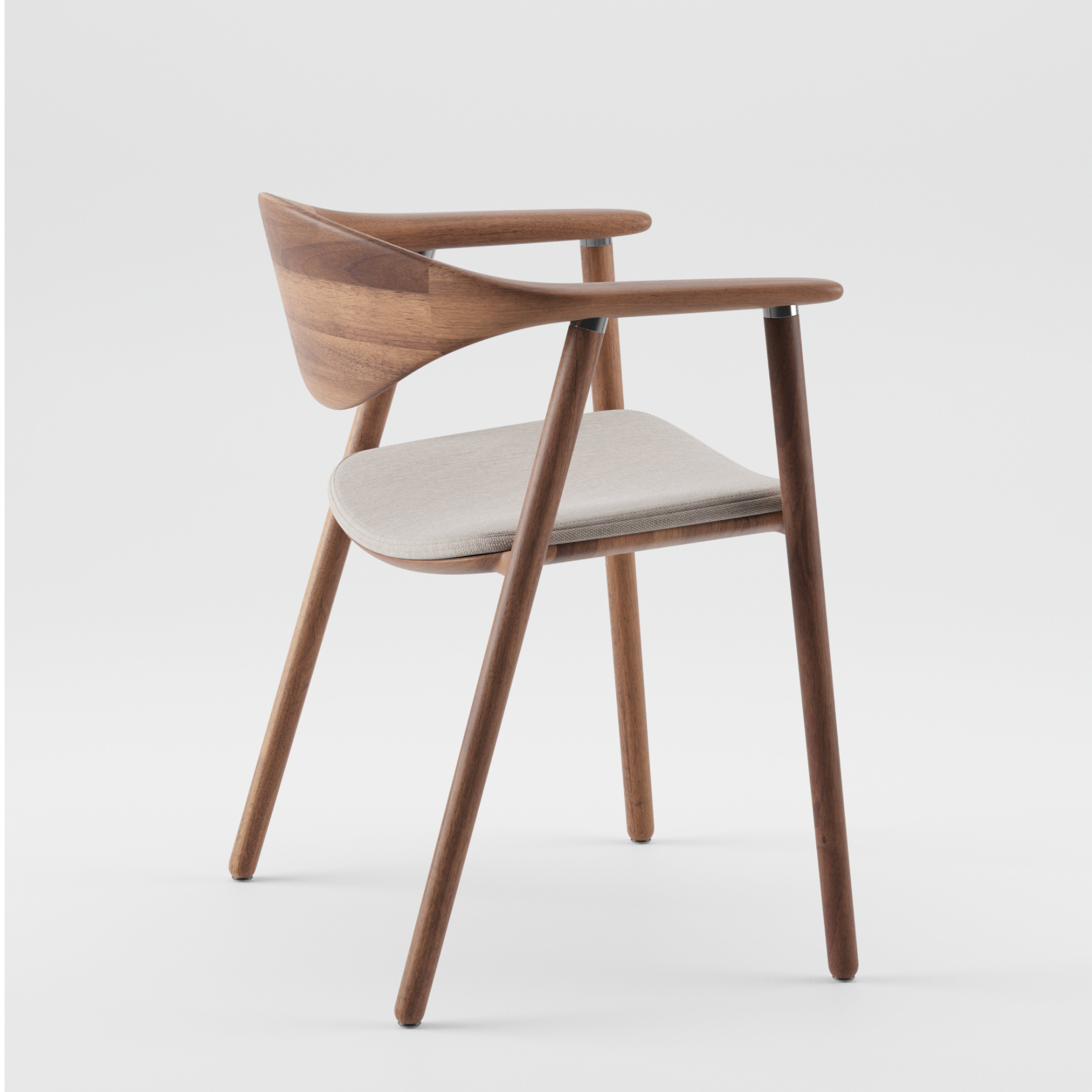 The Artisan NARU Chair features a minimalist design with a curved backrest and armrests, crafted from solid wood. It has four angled legs and a light gray cushioned seat, combining natural aesthetics with eco-friendly materials against a plain white backdrop.