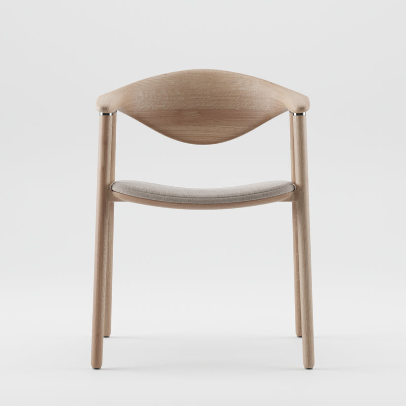 The NARU Chair Upholstered Seat by Artisan is a modern wooden chair crafted from solid wood with a curved backrest and armrests, featuring a light gray cushioned seat. Finished with natural oils for minimalistic charm, it sits against a plain white background.