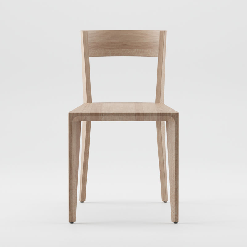 The HANNY Chair by Artisan, crafted from solid wood, features a minimalist design with a straight backrest and square seat. Its clean lines and natural wood grain are highlighted against a plain white background, emphasizing its environmentally-friendly materials.
