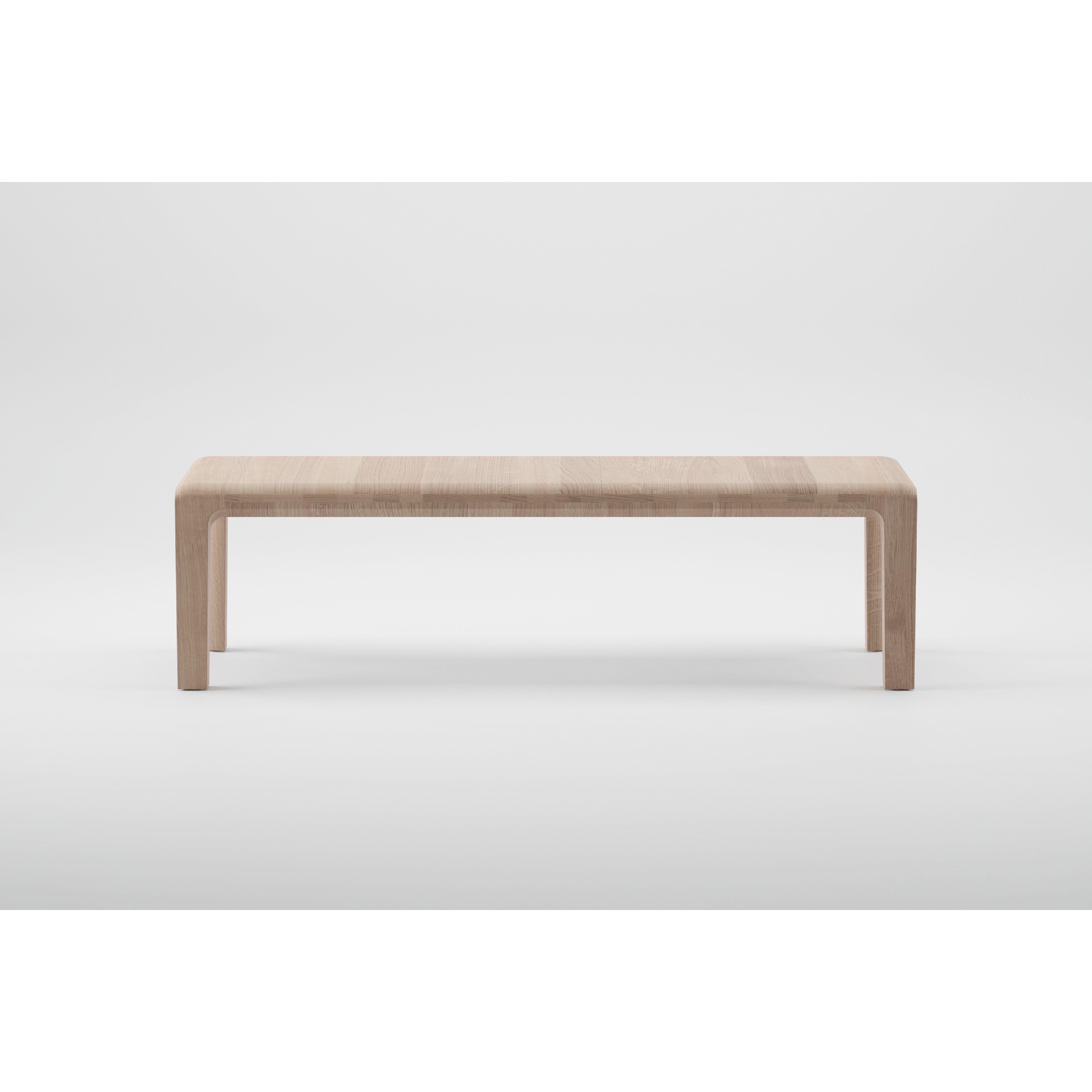 The Artisan INVITO Bench is a minimalist solid wood piece featuring a smooth, rectangular top with rounded edges, crafted from environmentally-friendly materials and showcased against a plain white background.