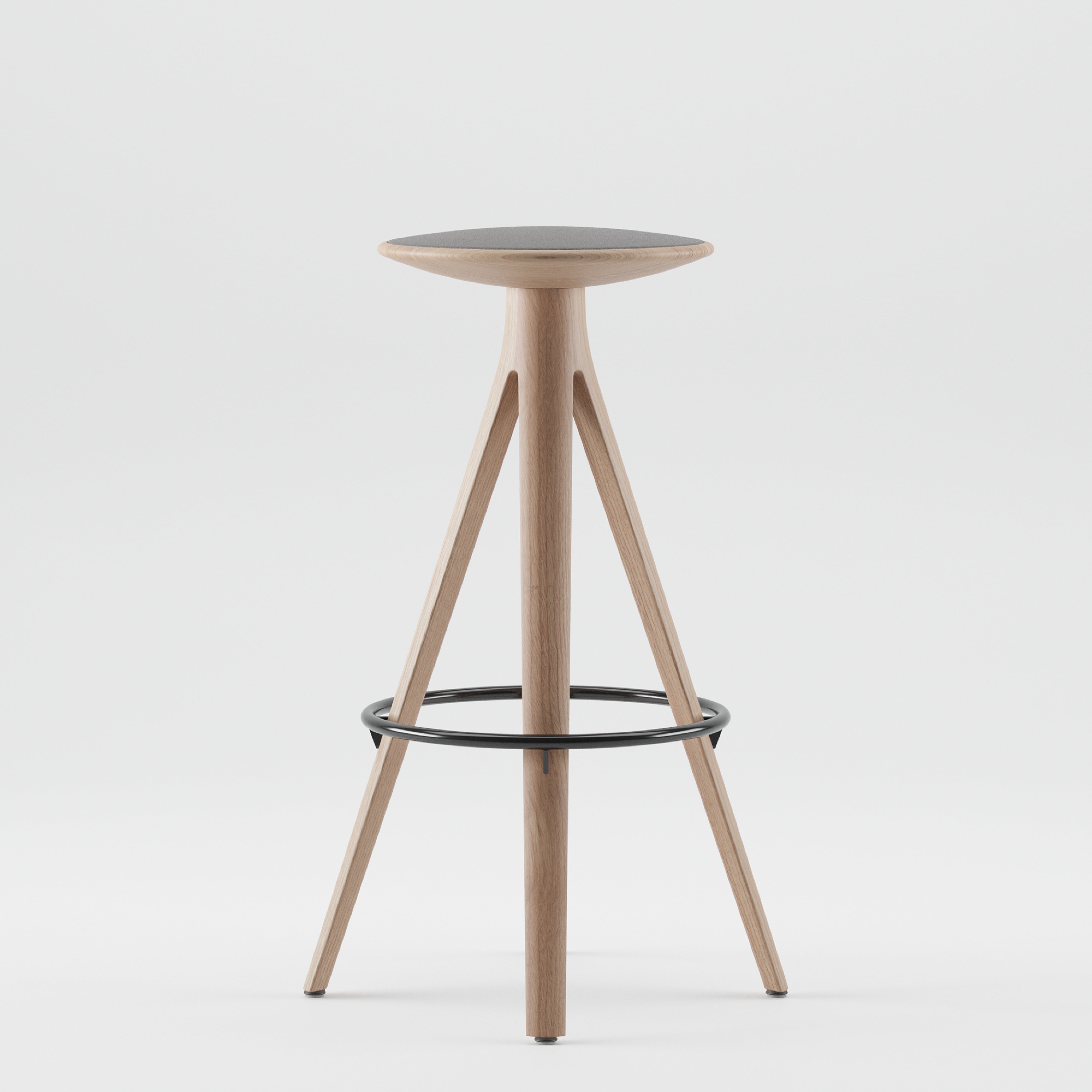 The KALOTA Barstool by Artisan features a sleek, modern design with a solid wood, three-legged frame and a round seat. Natural wood tones, enhanced by natural oils, contrast the black metal footrest. Its minimalist and eco-friendly style stands out against a plain white background.