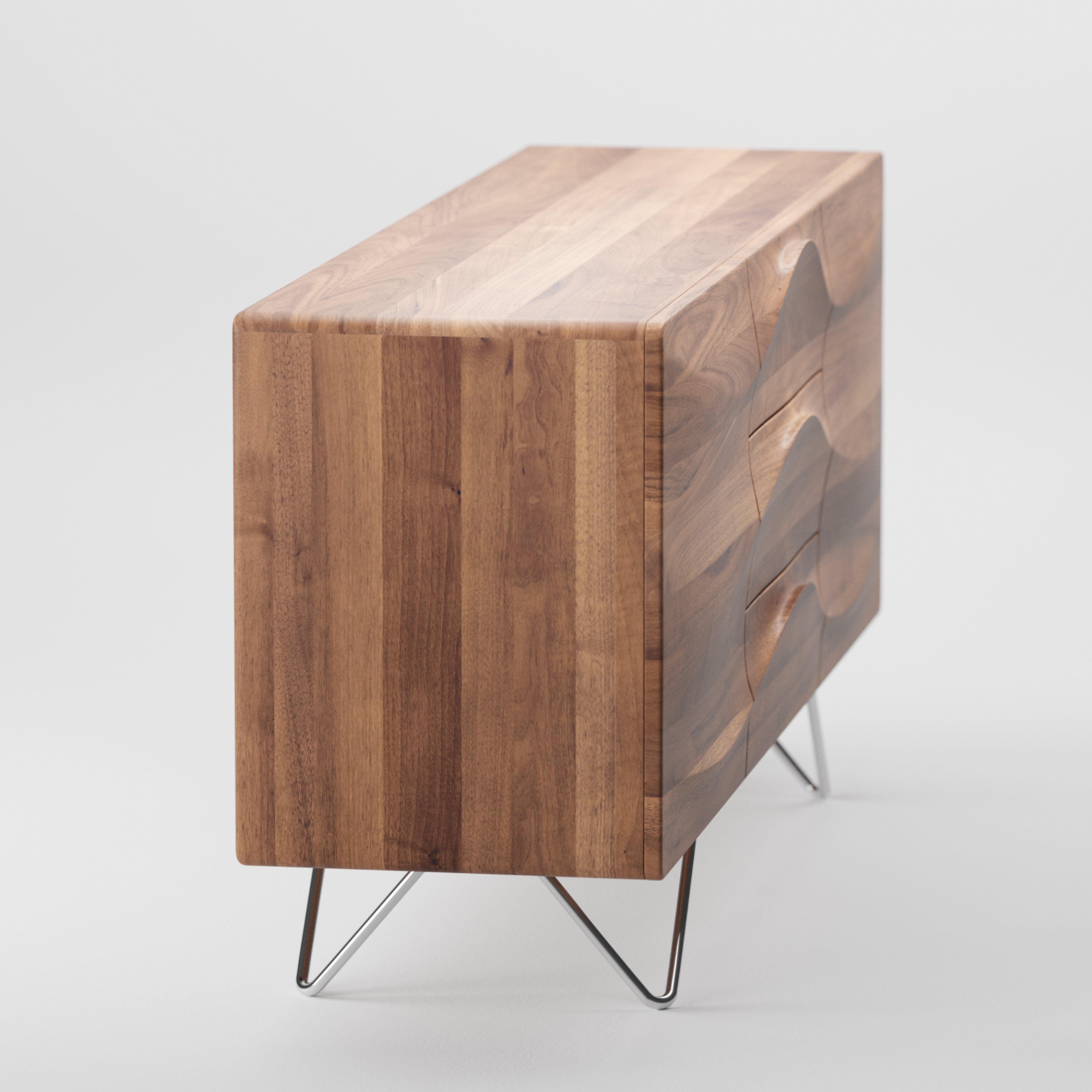 The Artisan LASTA Sideboard is a sleek, modern piece crafted from solid wood, featuring a smooth, angled surface and minimalist design on thin metallic legs. Finished with natural oils, it showcases alternating wood grain patterns for an eco-friendly touch.