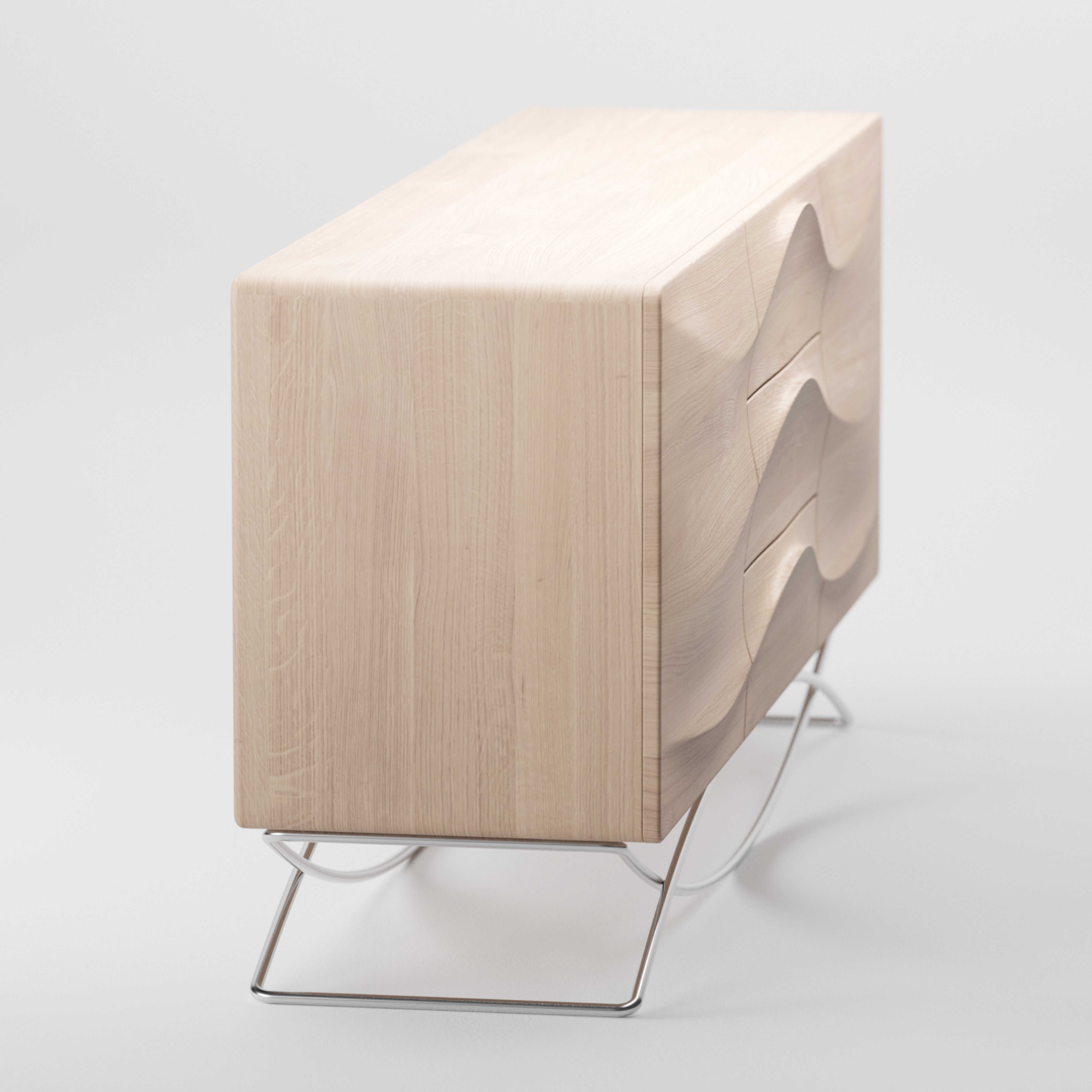 The LASTA Sideboard by Artisan is a modern piece crafted from solid wood with wavy drawer fronts, enhanced with natural oils. It features a light finish and rests on slim metal legs for an eco-friendly, sleek look against a plain white background.