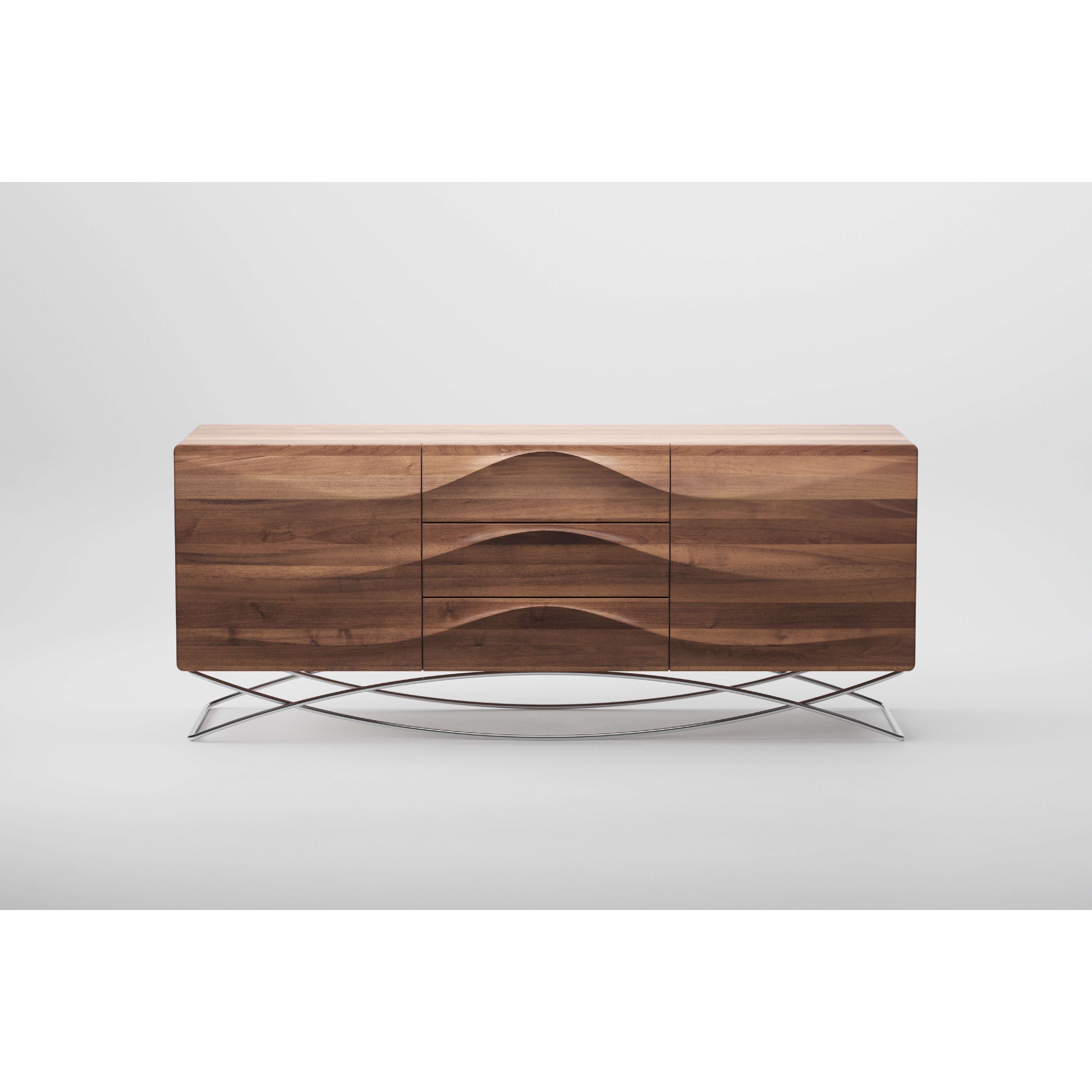 The LASTA Sideboard by Artisan, crafted from solid wood, showcases a smooth wave-like pattern on two doors and three drawers. It stands on thin metal legs with a cross-brace design, finished in natural oils for eco-friendliness, set against a plain white background.
