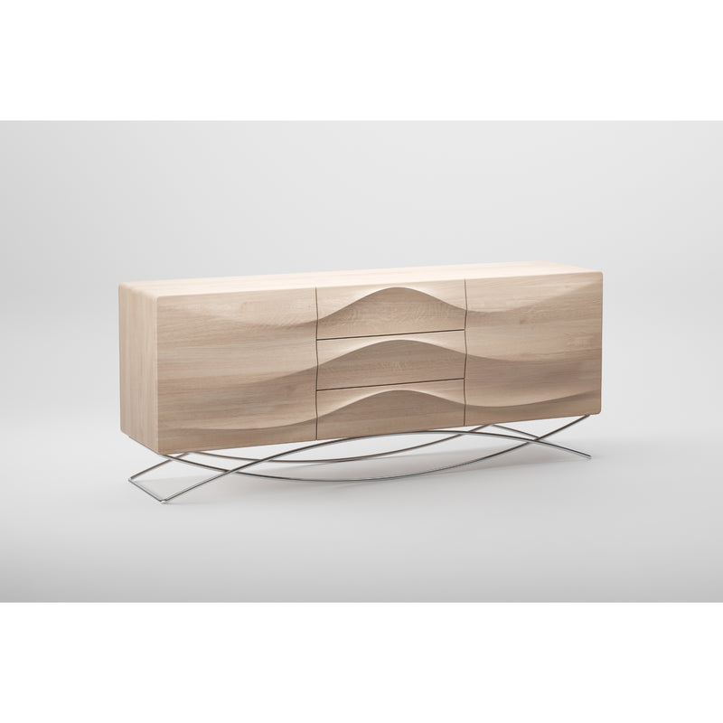 The LASTA Sideboard by Artisan is a modern piece crafted from solid wood with a light finish and a wavy front design. Enhanced with natural oils, it features smooth lines and stands on slender, curved metal legs, set against a white background.