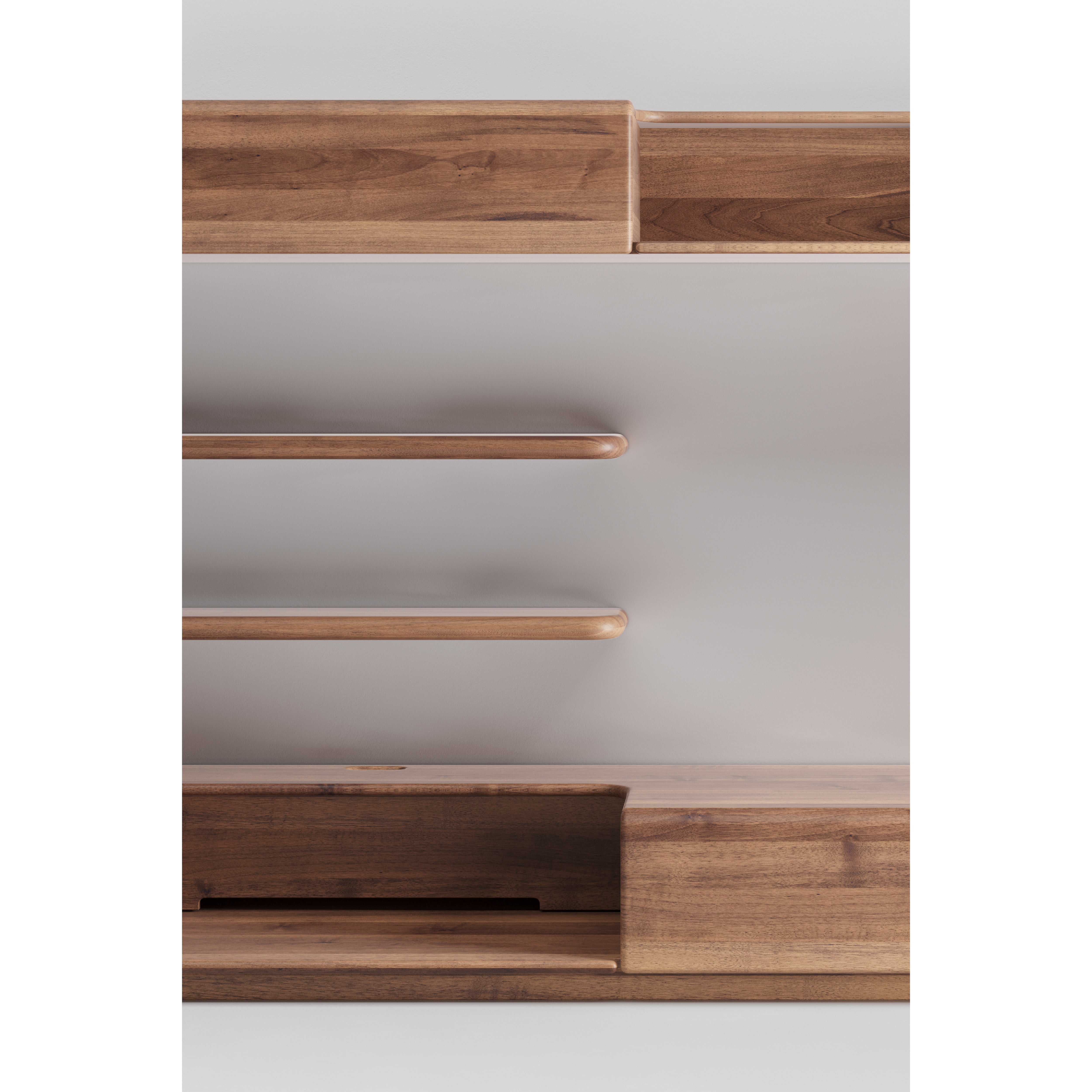 The LATUS Modular System by Artisan offers minimalist wooden shelving with two floating shelves and a base with a drawer and open compartment. Crafted from eco-friendly solid wood, its warm, natural finish complements any neutral wall.