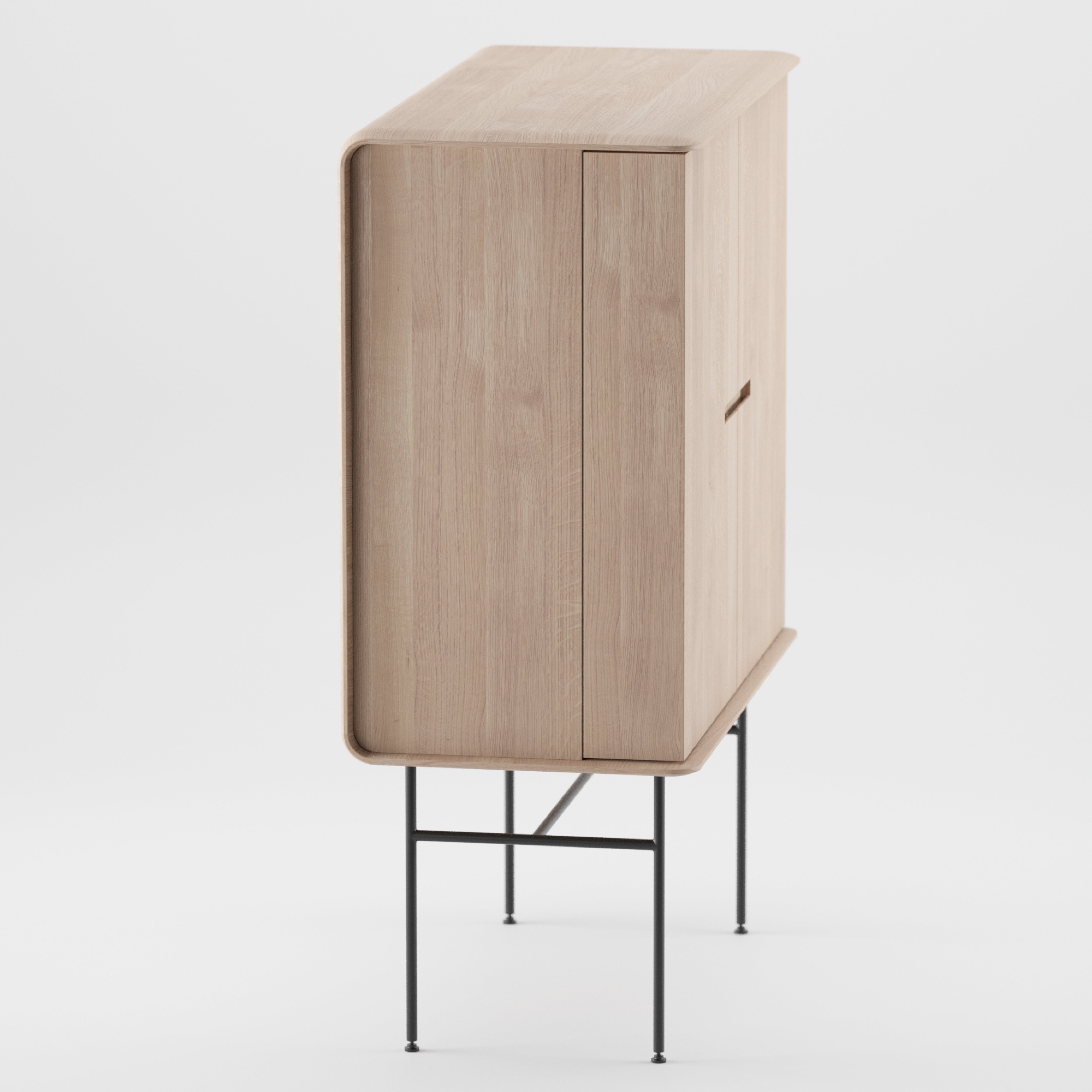 The Leno Bar by Artisan features a minimalist design with a solid wood cabinet, rounded edges, and slim black metal legs. Photographed against a white background, it embodies modern simplicity and artisan craftsmanship.