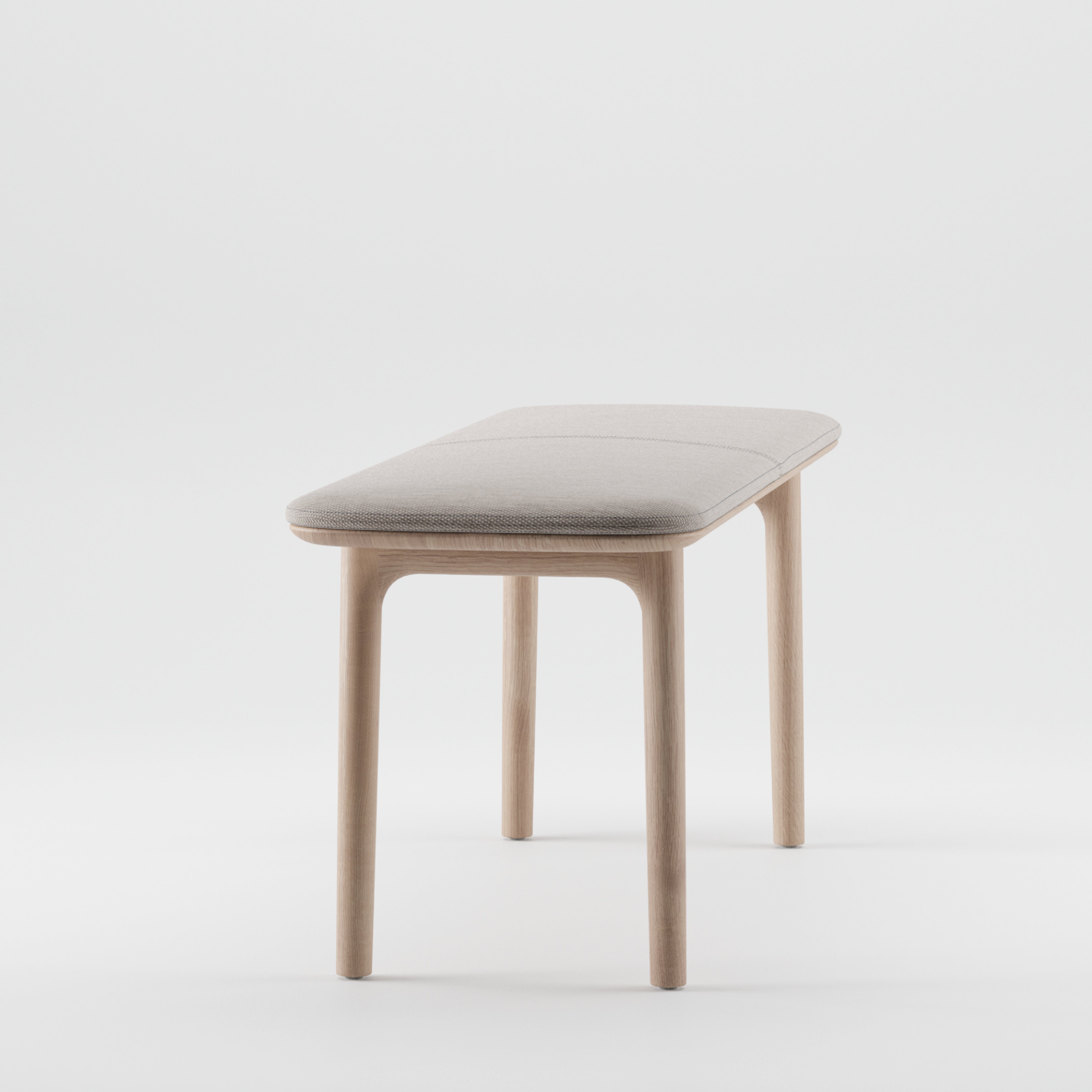 The NEVA Bench by Artisan features a minimalist design with a light beige cushioned seat and four wooden legs, expertly crafted from organic wood. The elegant structure stands out beautifully against a plain white background.