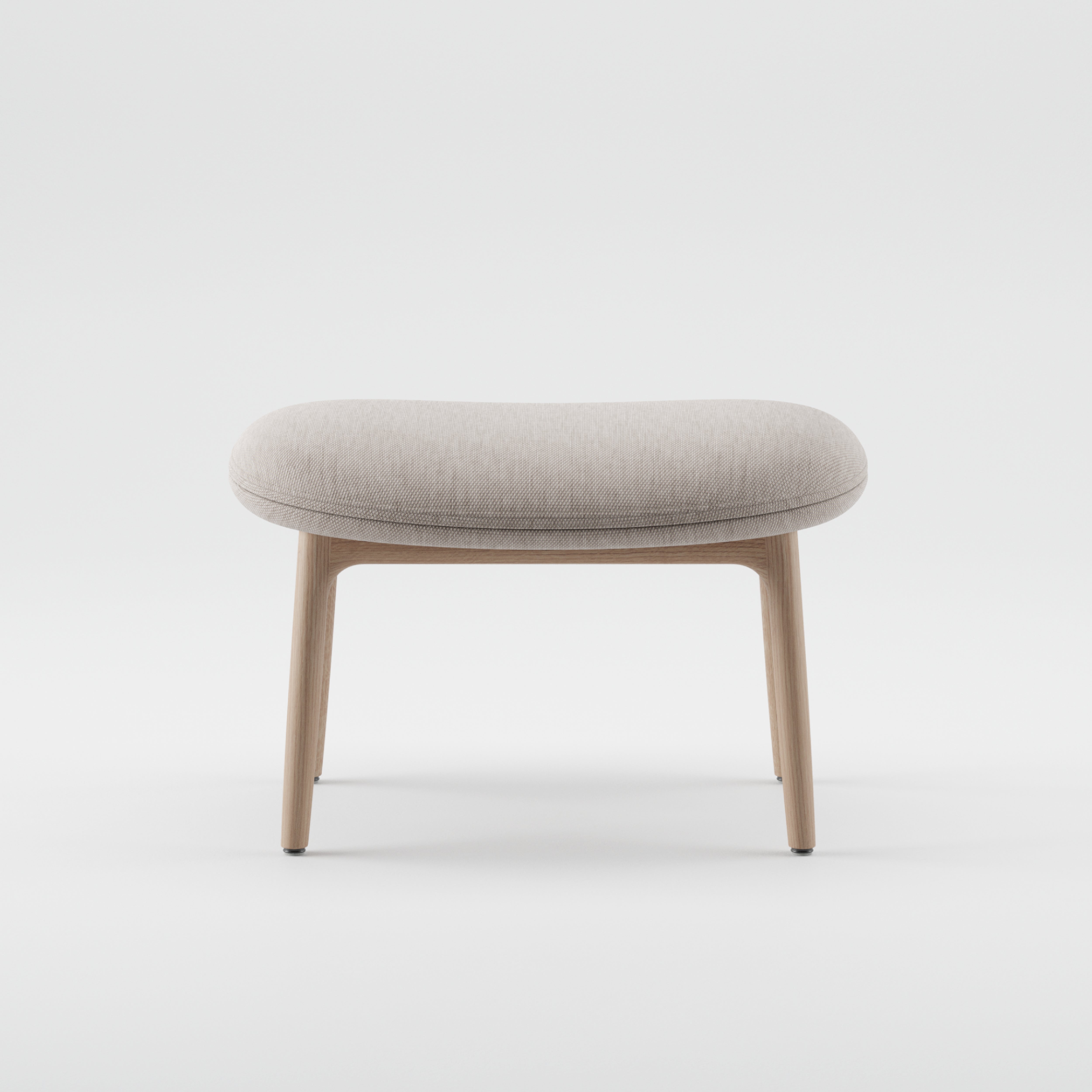 The NEVA Ottoman by Artisan features a light gray cushioned seat and wooden legs, embodying modern Scandinavian design. Its minimalist style highlights clean lines and simplicity on a plain white background, crafted to perfection through CNC carving for added precision.