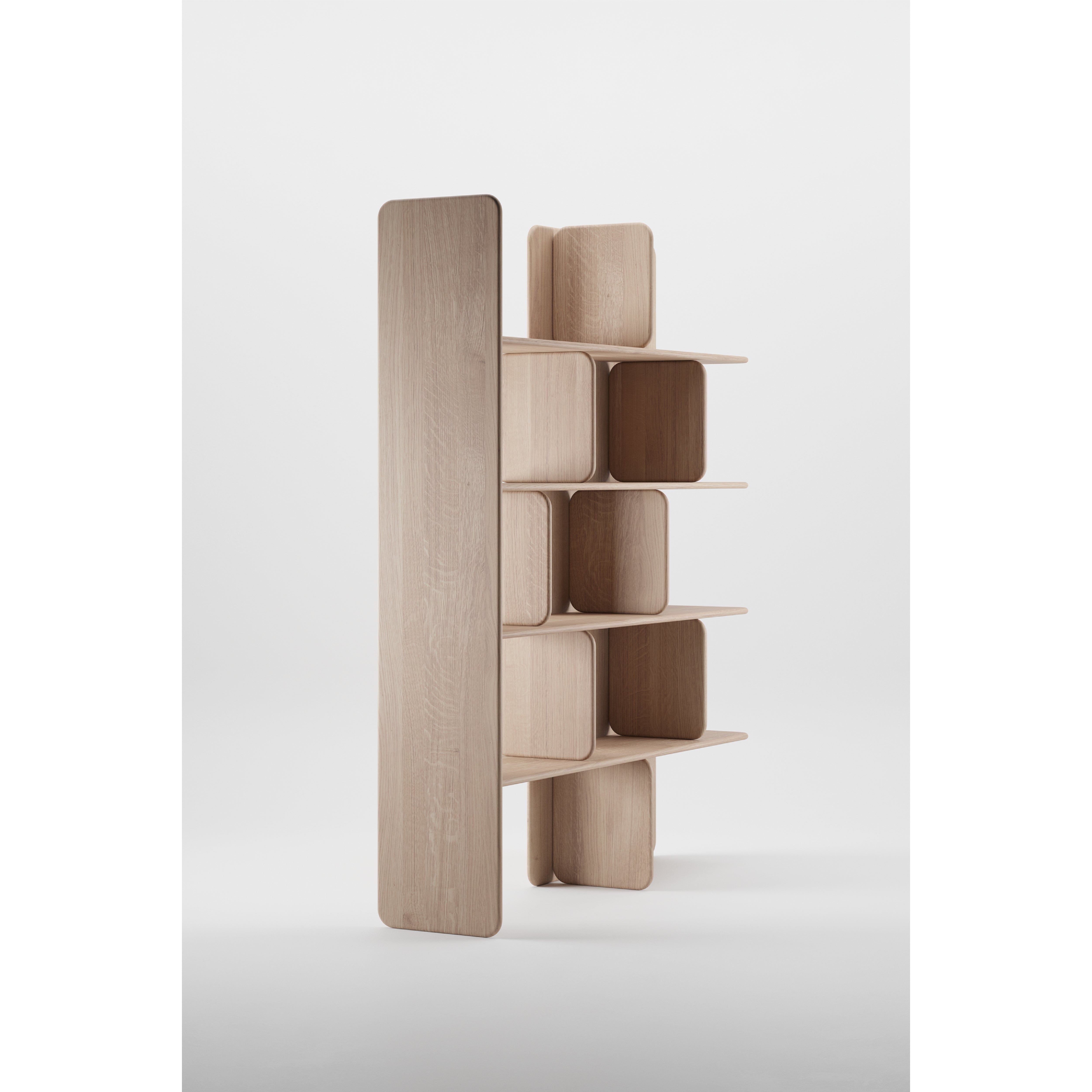The Artisan SOFT Shelf is a modern, minimalist wooden unit with an asymmetric design. It features rounded rectangular shelves of various sizes and a tall smooth vertical panel. Made from solid wood with a natural finish, it emphasizes environmentally-friendly materials.