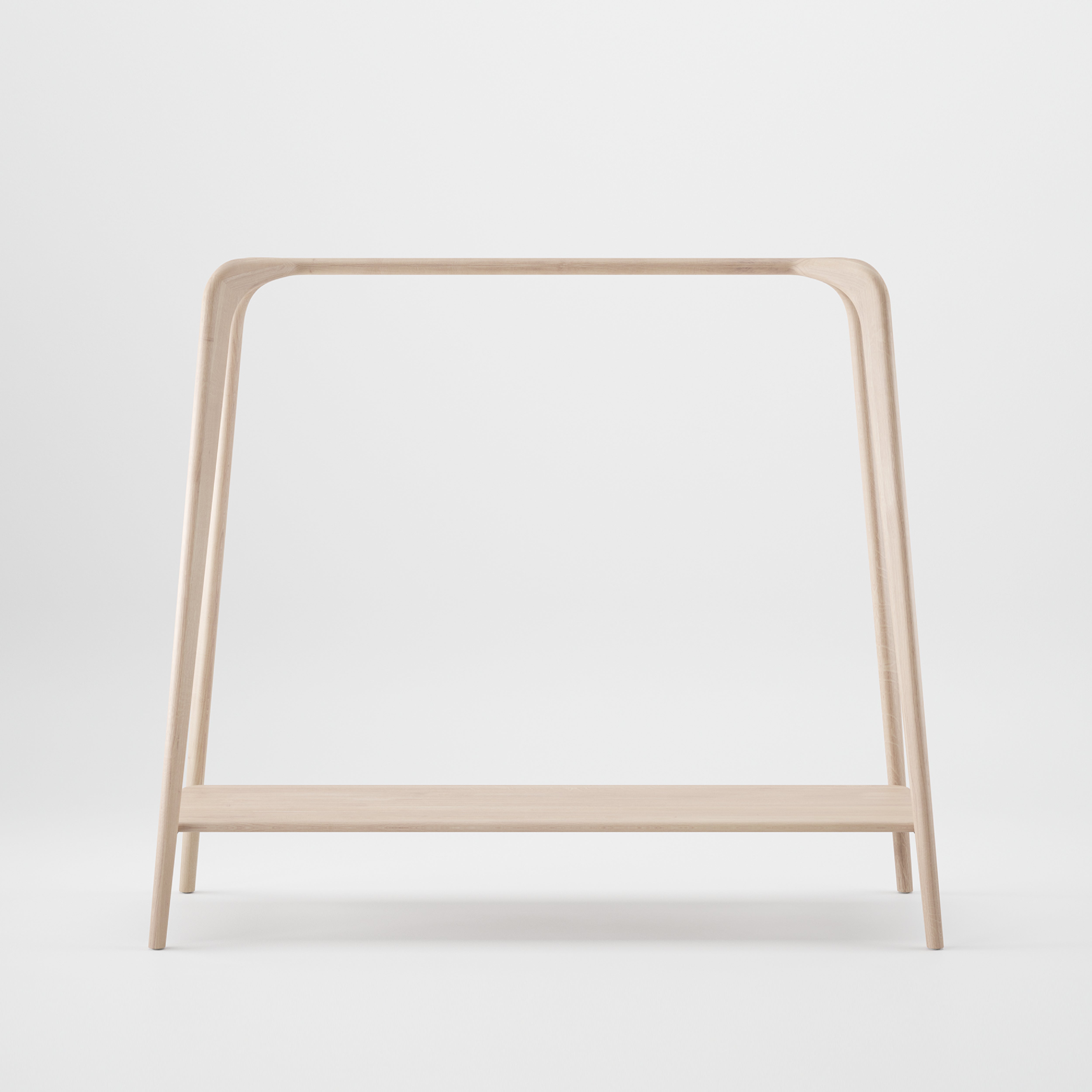 The SWING Coat Stand by Artisan is a minimalist wooden clothing rack with an A-frame design. Crafted from solid wood, it features a single horizontal beam for hanging clothes and a flat shelf for storage, all set against a plain white background.