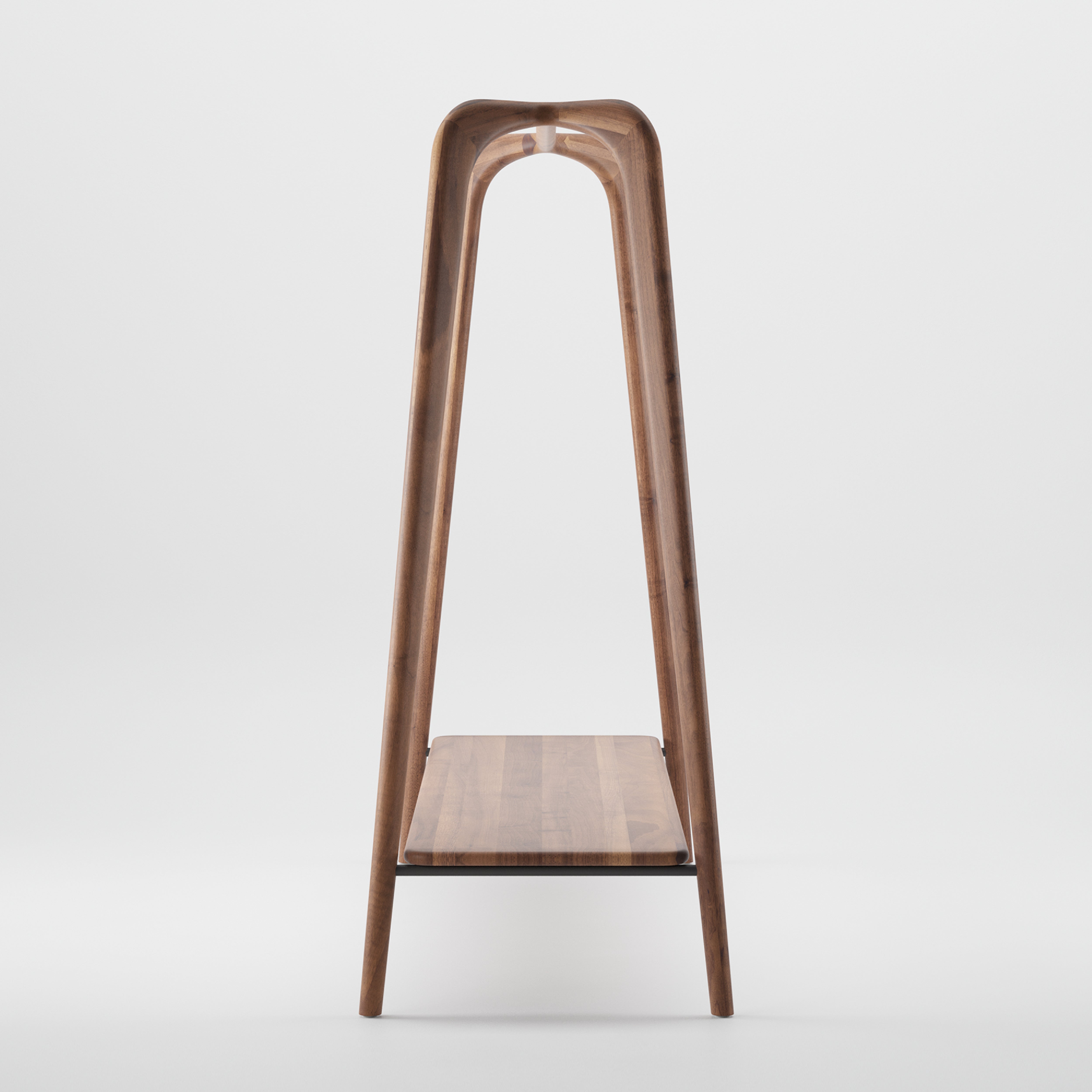The Artisan SWING Coat Stand is a minimalist piece with a ladder-like design, crafted from solid wood. It showcases a luxurious wood texture and a curved top, featuring one horizontal shelf against a plain white background.