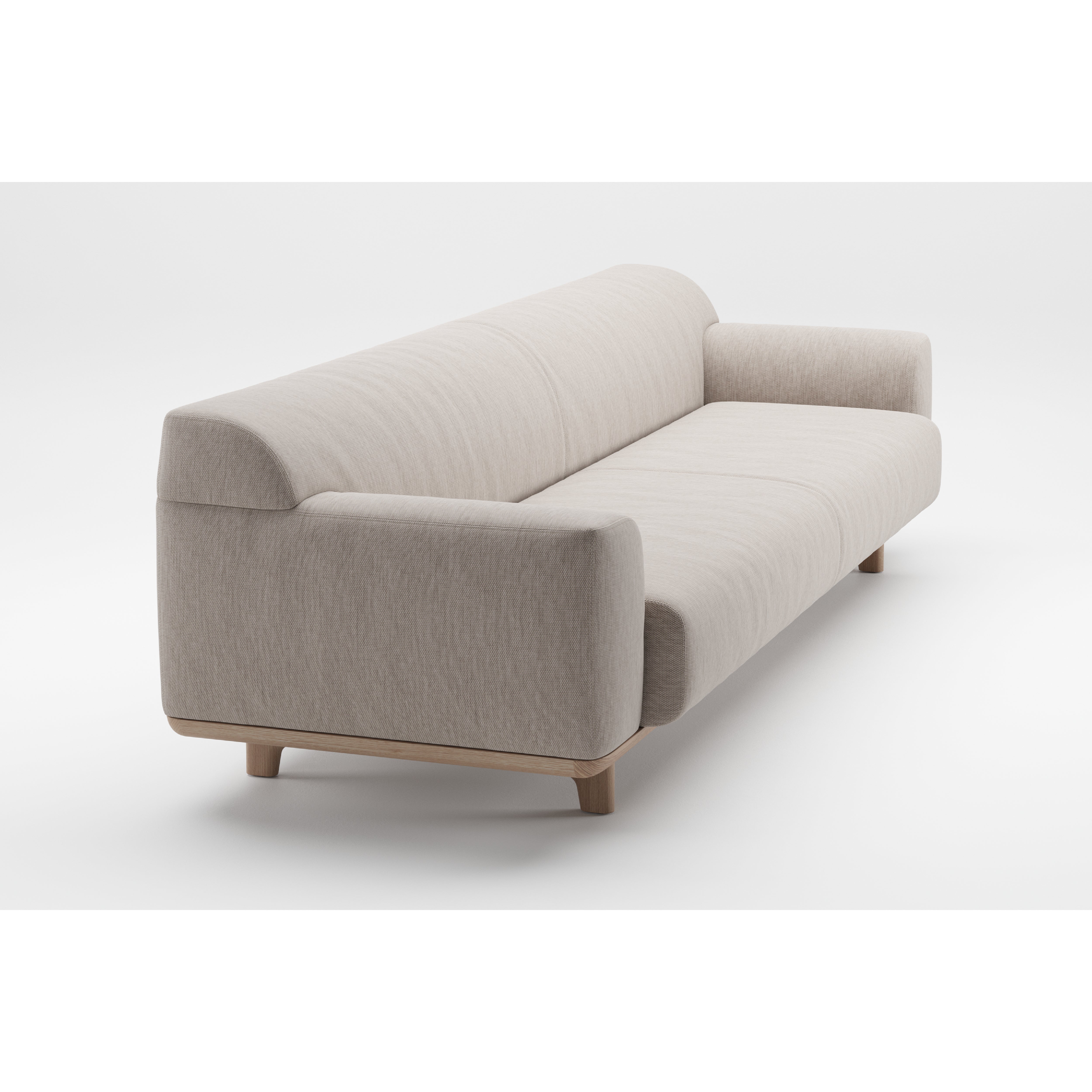 The Tara Sofa by Artisan is a modern, light beige piece with a minimalist design and clean lines, featuring an eco-friendly solid wood base. It offers thick cushioned seats and armrests, all set against a white background to emphasize its simple elegance.