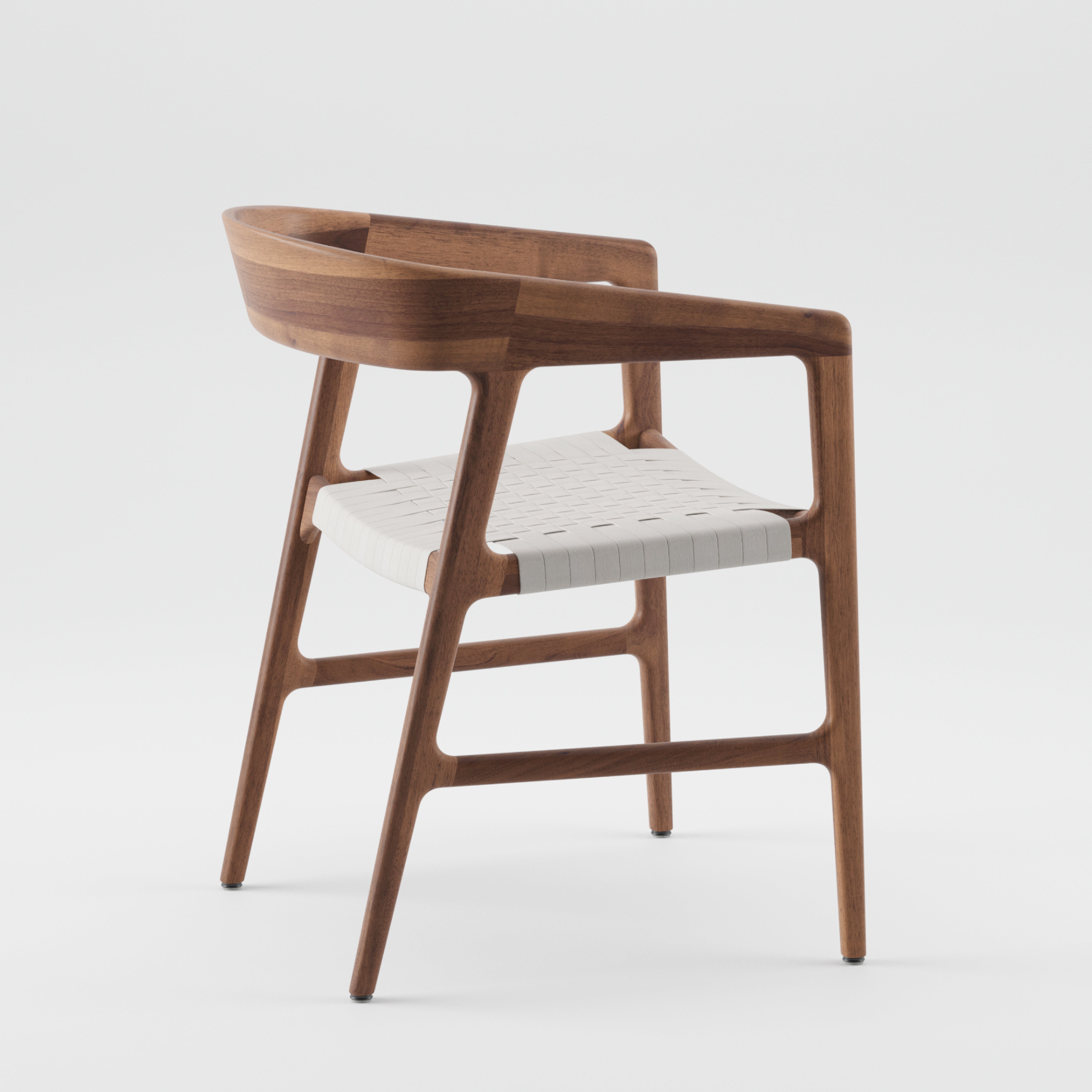 The TESA Chair by Artisan is a modern wooden chair with a sleek design, featuring a light-colored woven seat, curved backrest, and angled legs. Crafted from solid wood with a smooth finish, it showcases minimalist aesthetics and organic beauty.