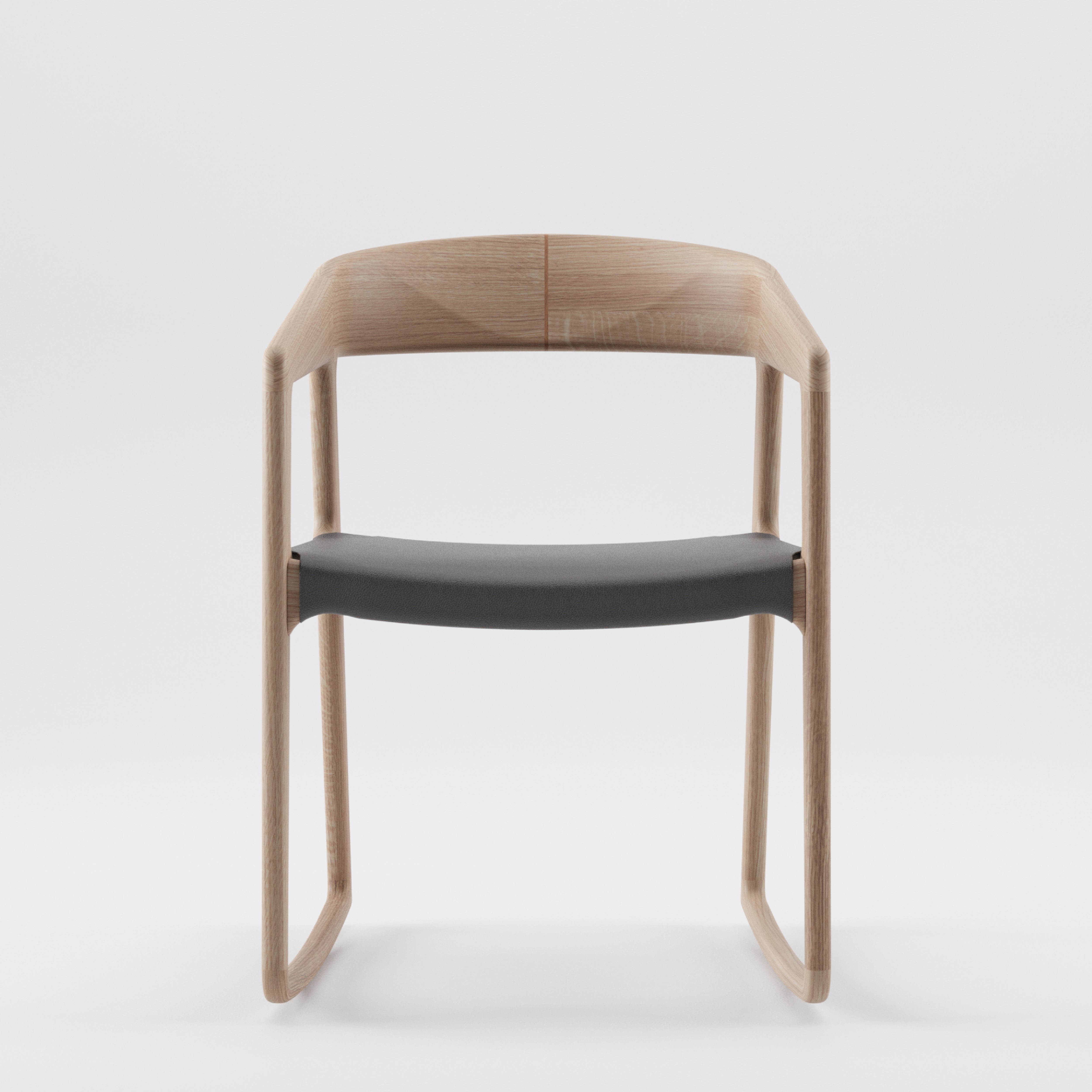 The Artisan TESA SWING CHAIR features a minimalist design with a curved backrest, crafted from solid wood and finished with natural oils. It has a dark cushioned seat, smooth edges, and an open back, set against a plain white background for an eco-friendly touch.